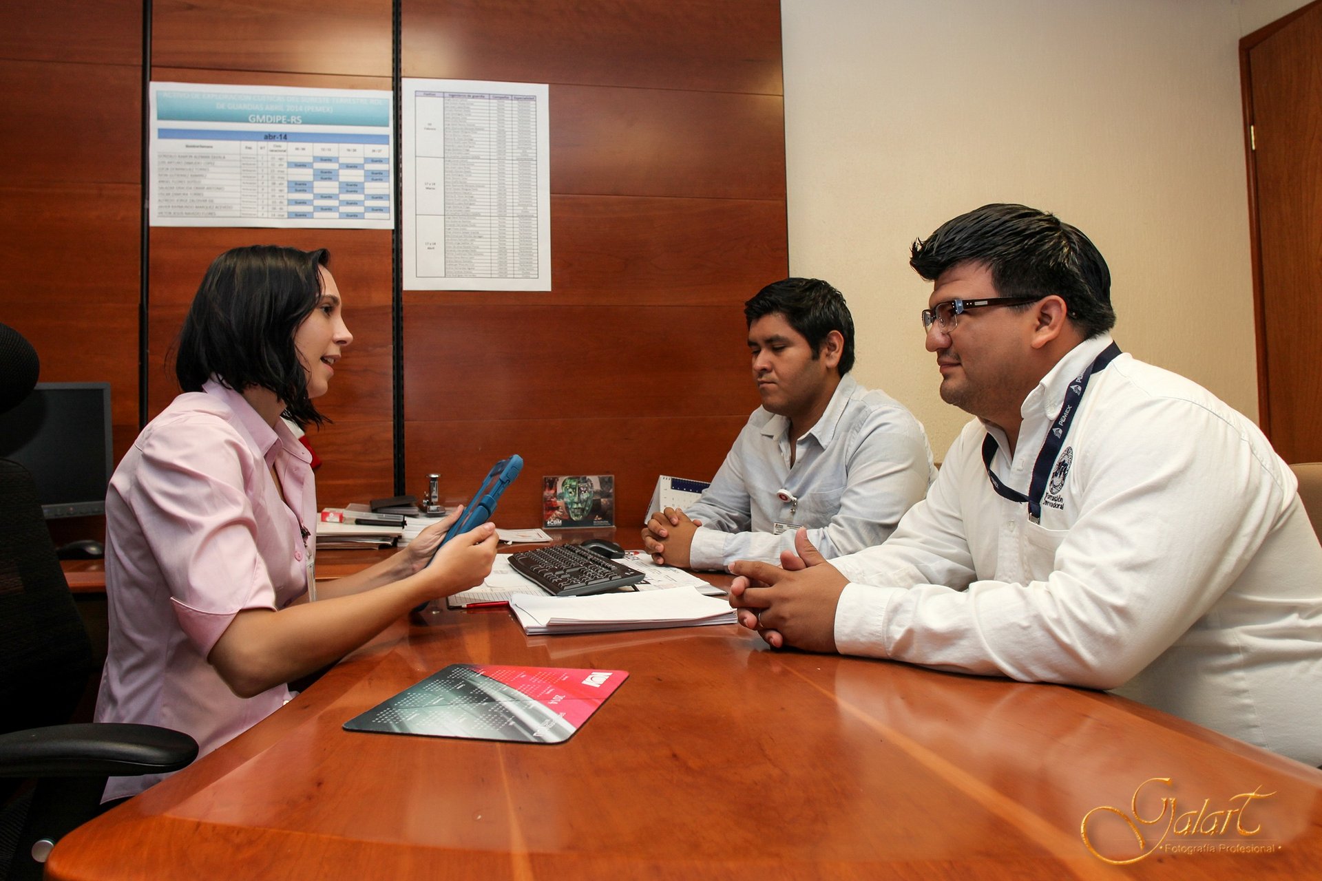 a group of doctors and nurses sitting around a table