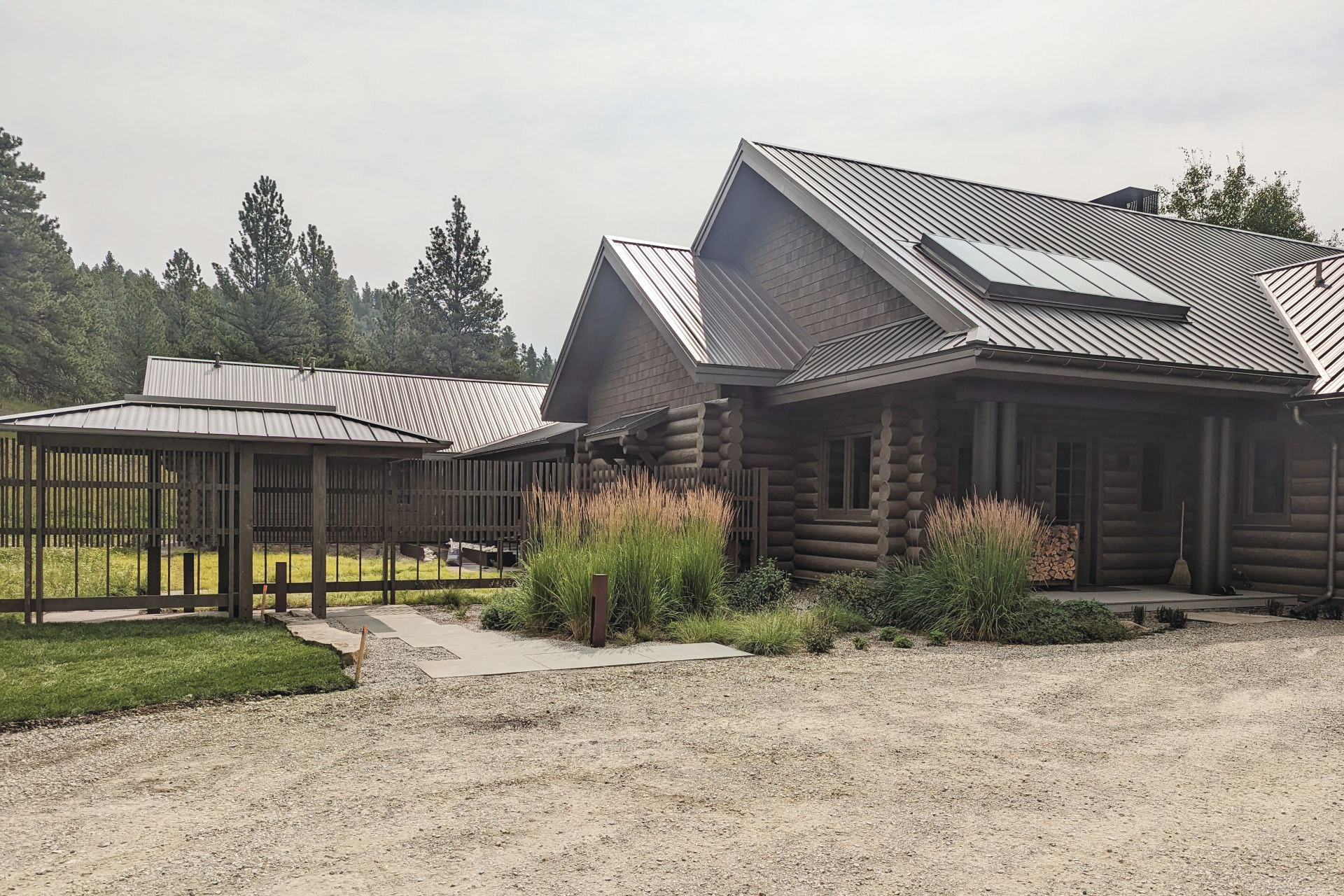 a log cabin with a metal roof