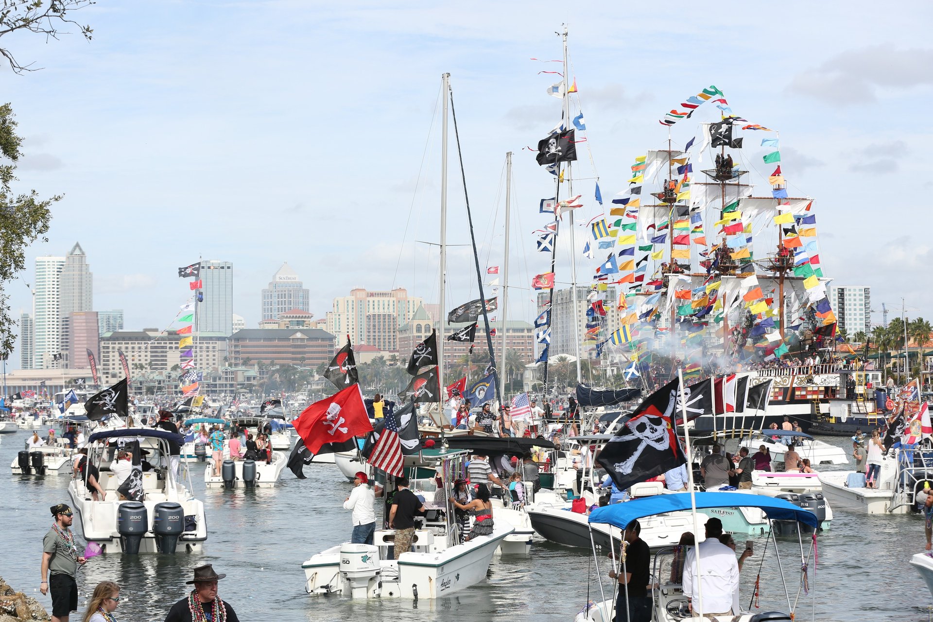 many boats in water at gasparilla invasion in Tampa, Florida