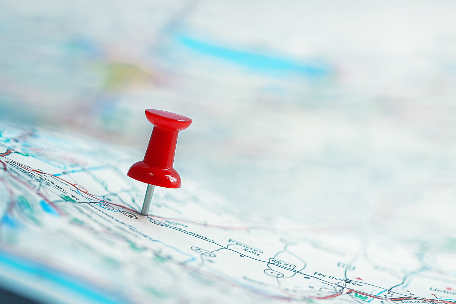 A thumbtack stuck into a map