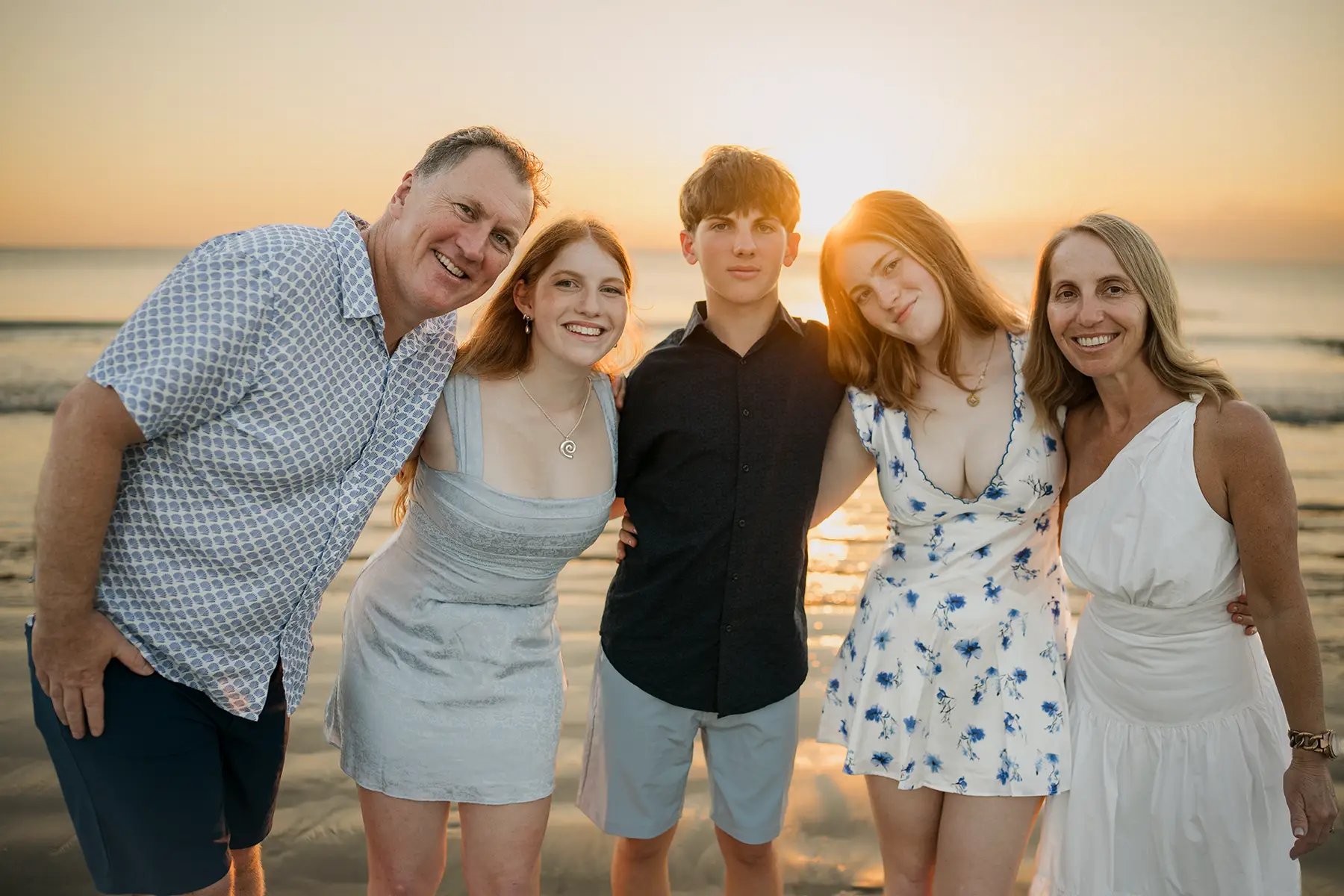 Natural family portrait captured during golden hour at Jimbaran Beach Bali