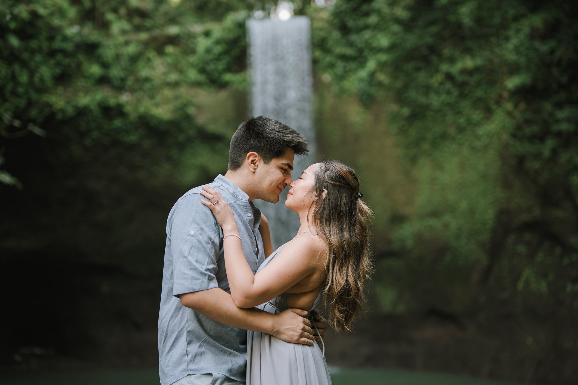 Intimate close embrace during prewedding at Tibumana Waterfall Bangli Bali