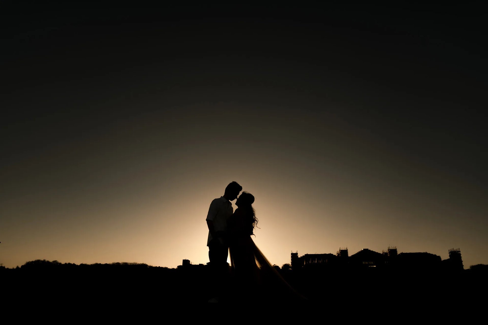 Silhouette couple photography during sunset at The Apurva Kempinski Bali beach