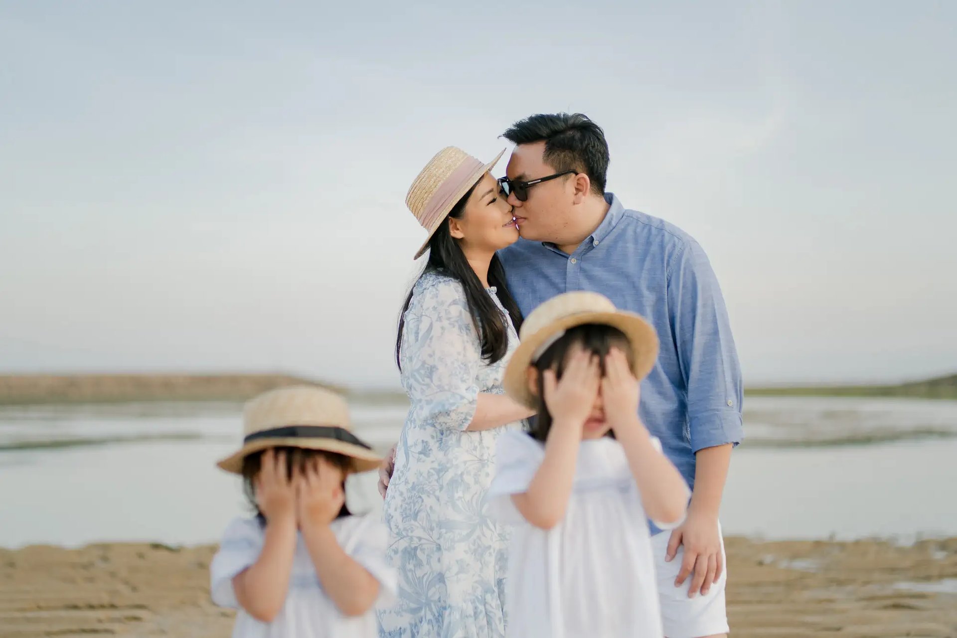 Candid family moments on the beach at The Apurva Kempinski Bali during golden hour