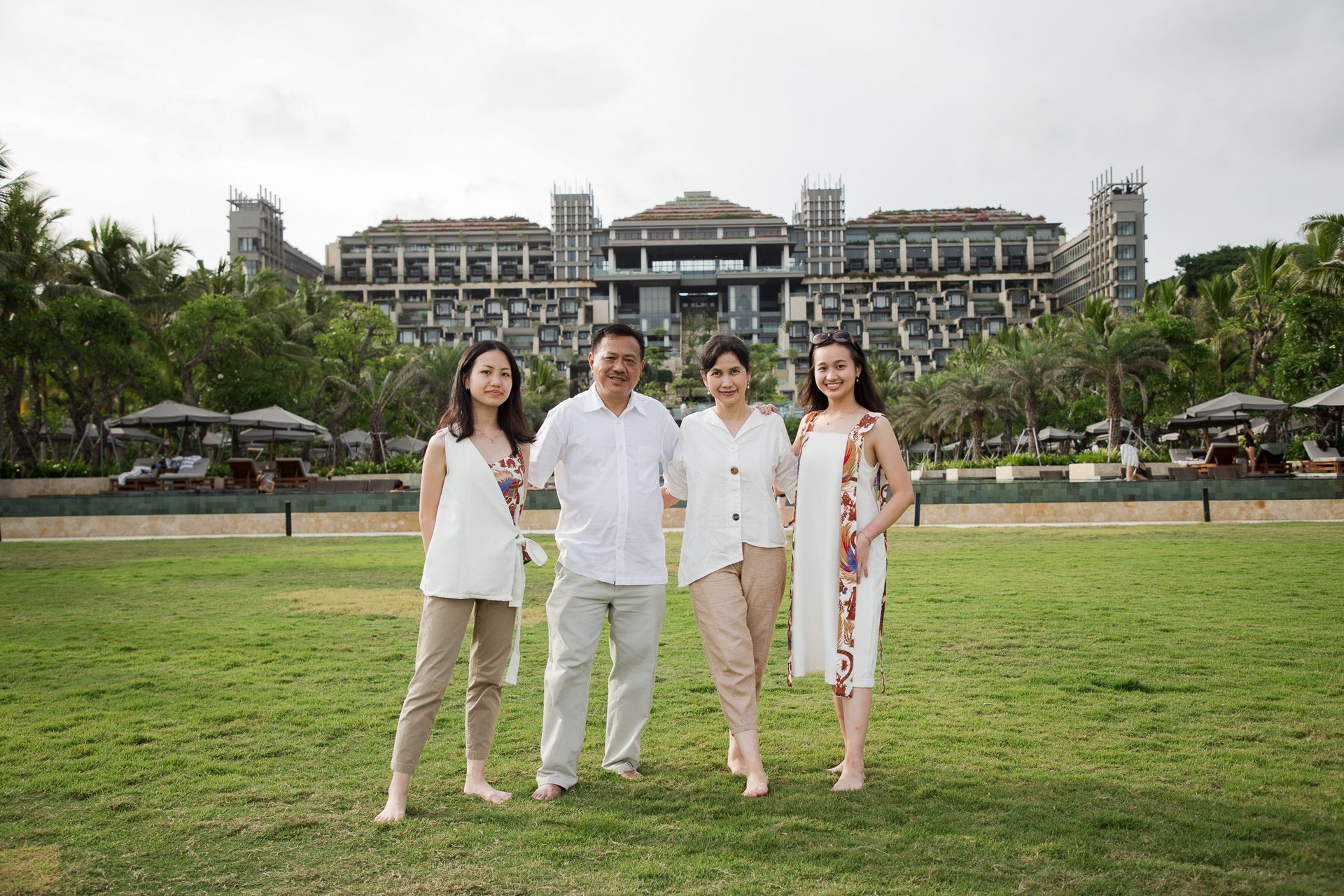 Family portrait in the garden area during a family photography session at Kempinski Bali resort