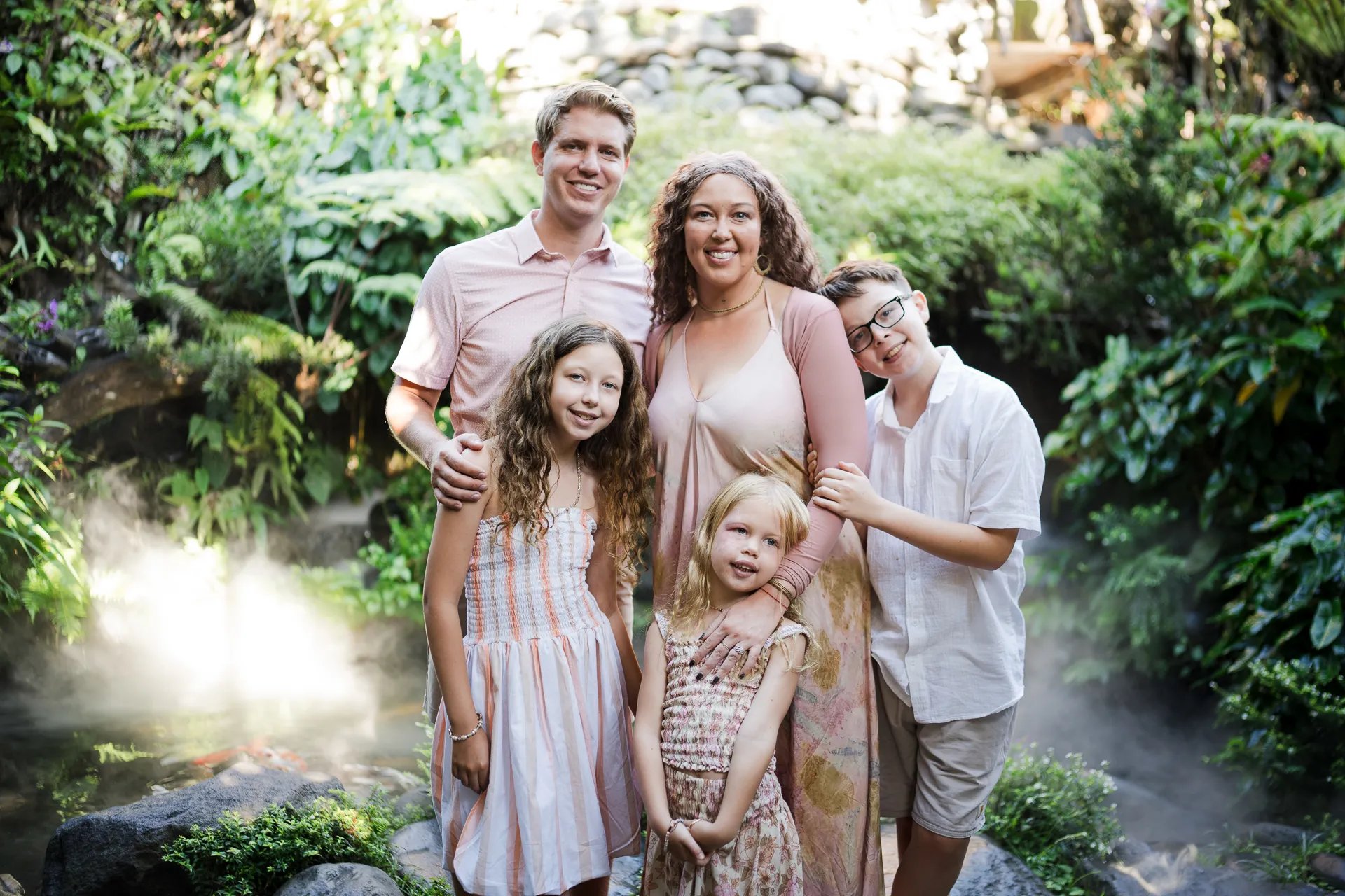 Natural family portrait at Umbul Sari Water Garden during a Bali family photography session