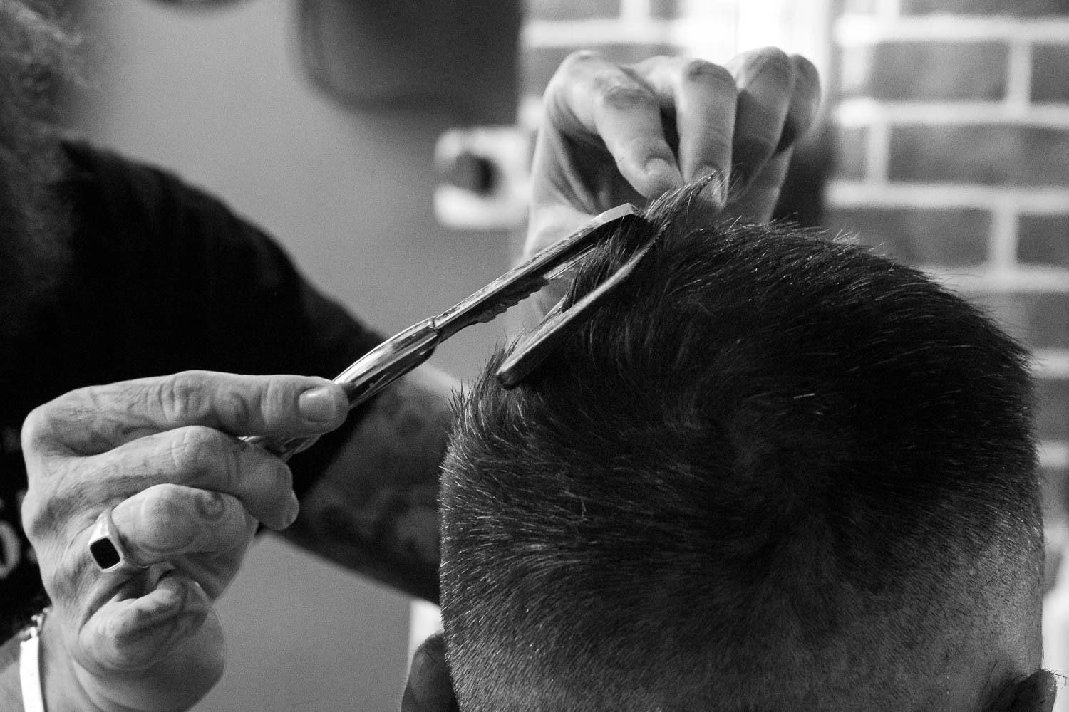 a man is cutting his hair with scissors and scissors
