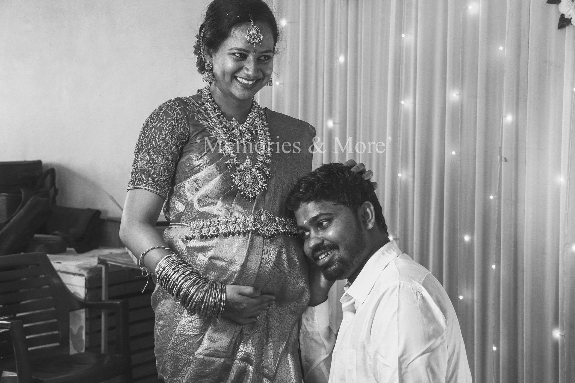 A bride wearing traditional Indian bridal jewellery and attire captured in a candid portrait by Memo