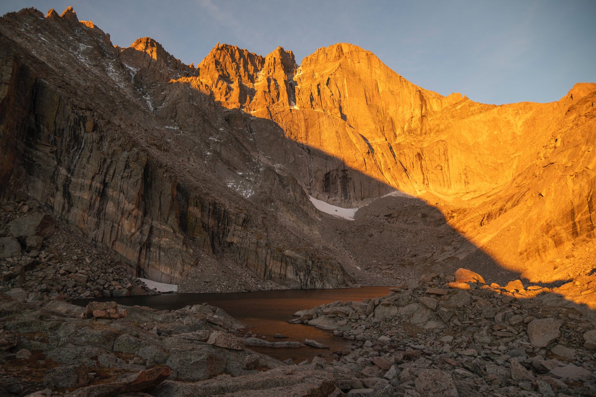 Longs Peak and chasm Lake glow brilliantly during summer sunrise