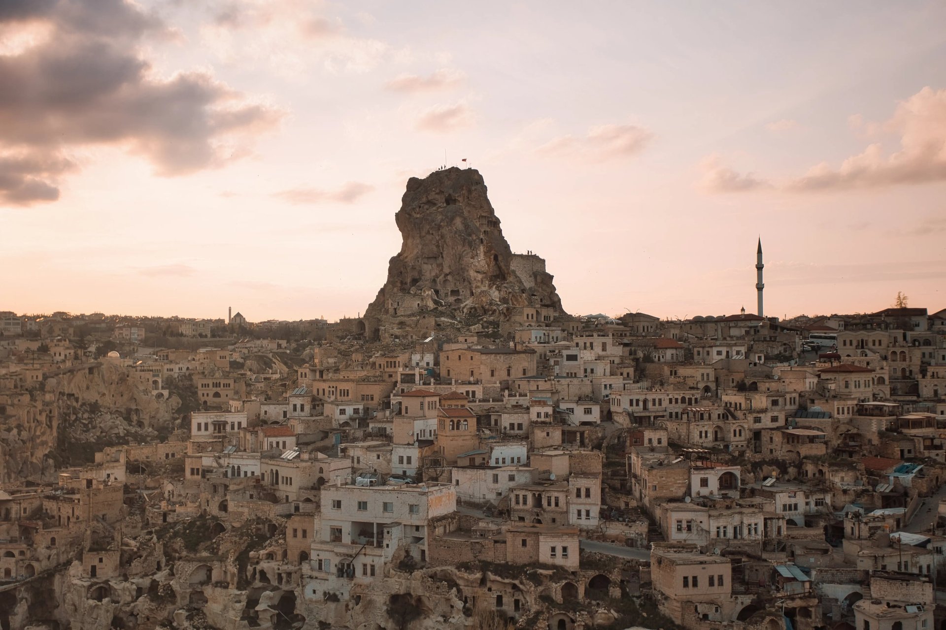 Sunset over Uçhisar Castle and stone village in Cappadocia, Turkey