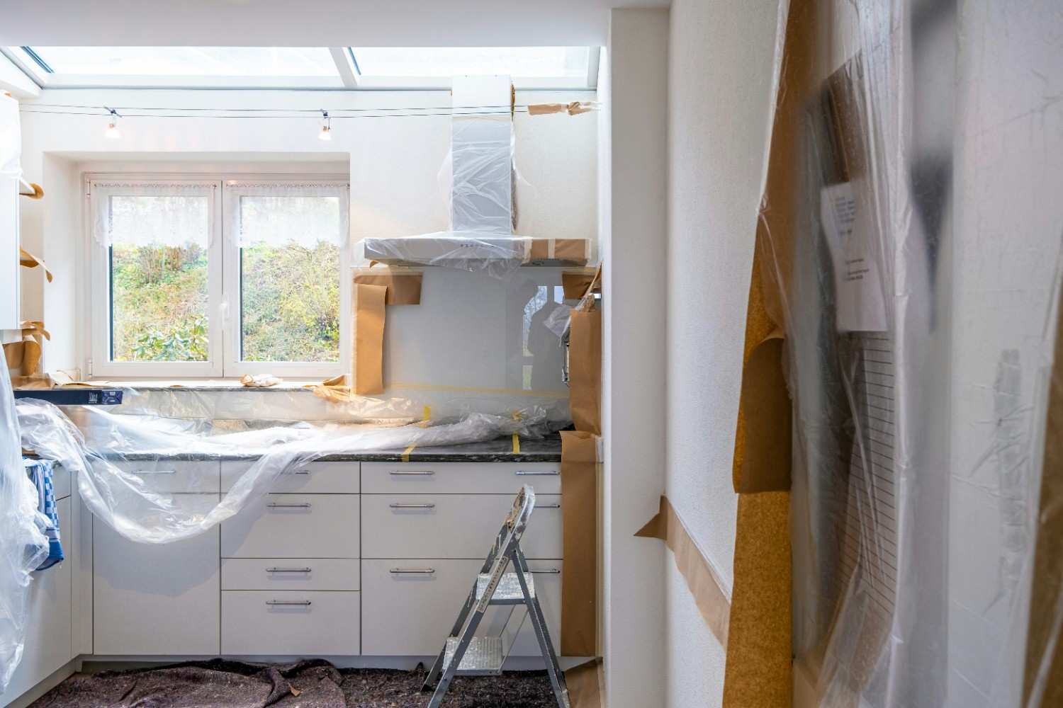 Home improvement contractor reviewing kitchen renovation plans with a Columbus Ohio homeowner