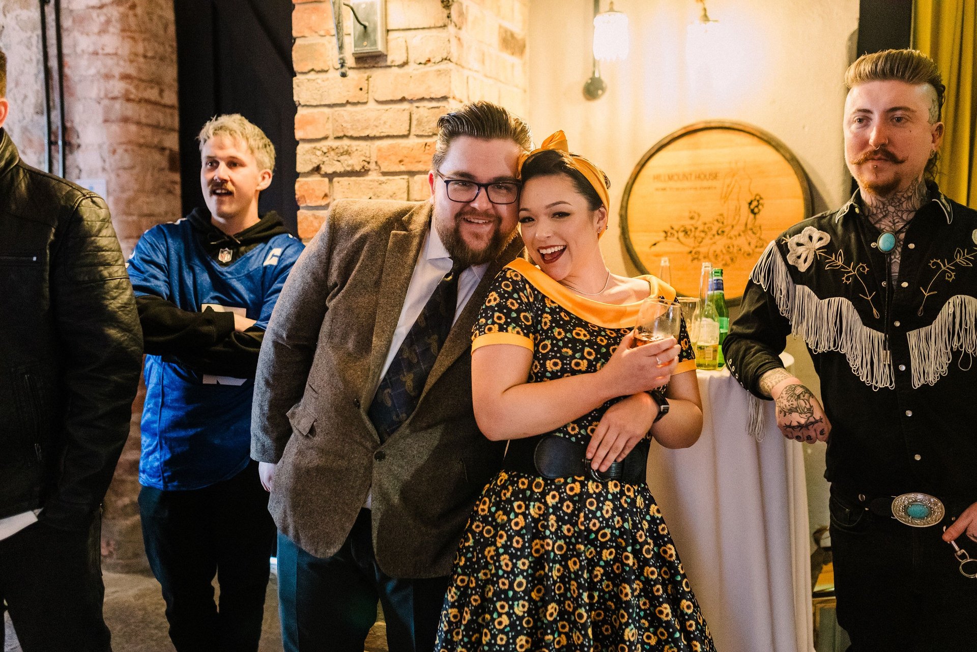 Man and woman smiling at 1950s murder mystery. stag party.