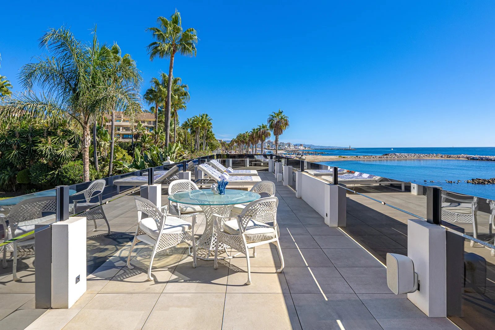 Outdoor dining terrace with sea views in luxury villa Marbella Golden Mile