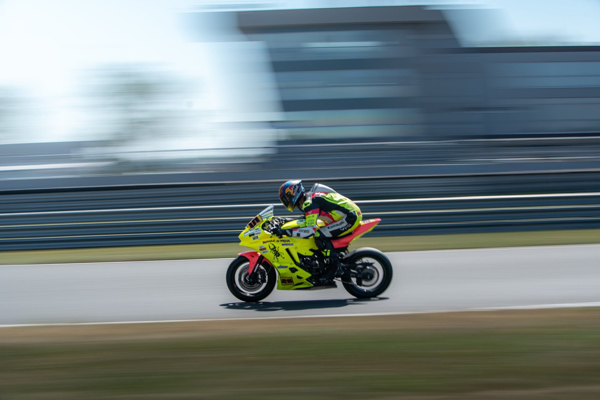 a person riding a motorcycle on a track