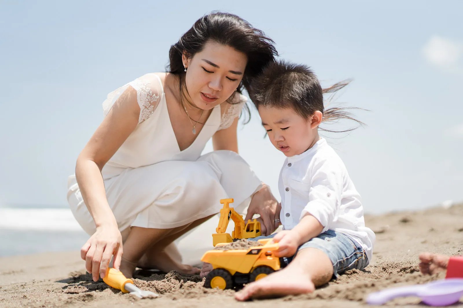 Mother and son sharing a quiet moment during a natural family session at W Bali Seminyak