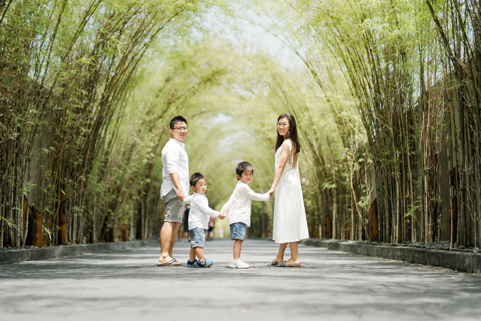 Family walking together during a relaxed family photography session at W Bali Seminyak