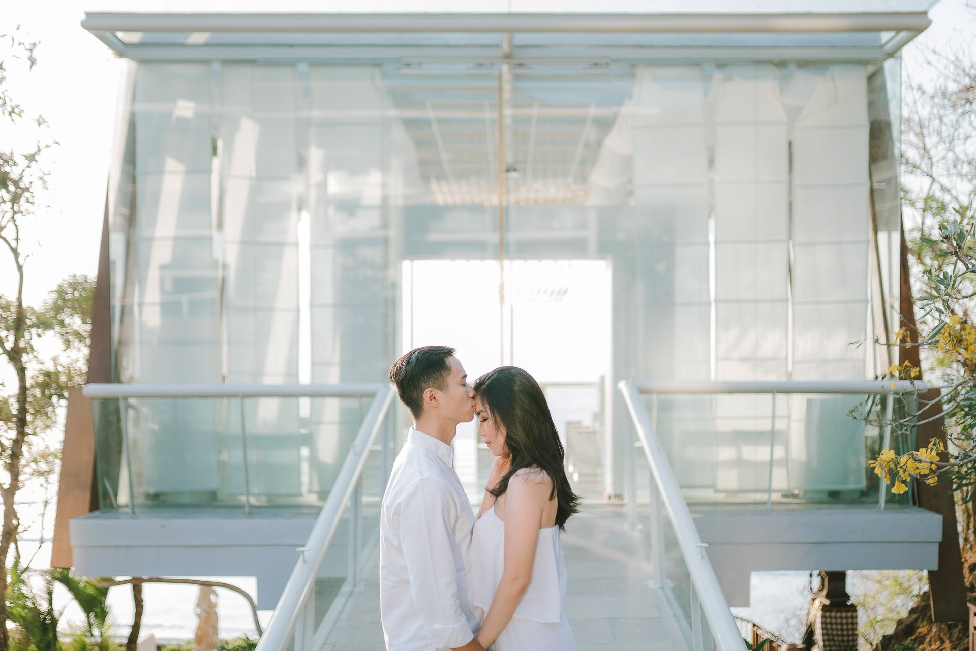 Couple during a proposal photography session in front of the chapel at Anantara Uluwatu Bali Resort.