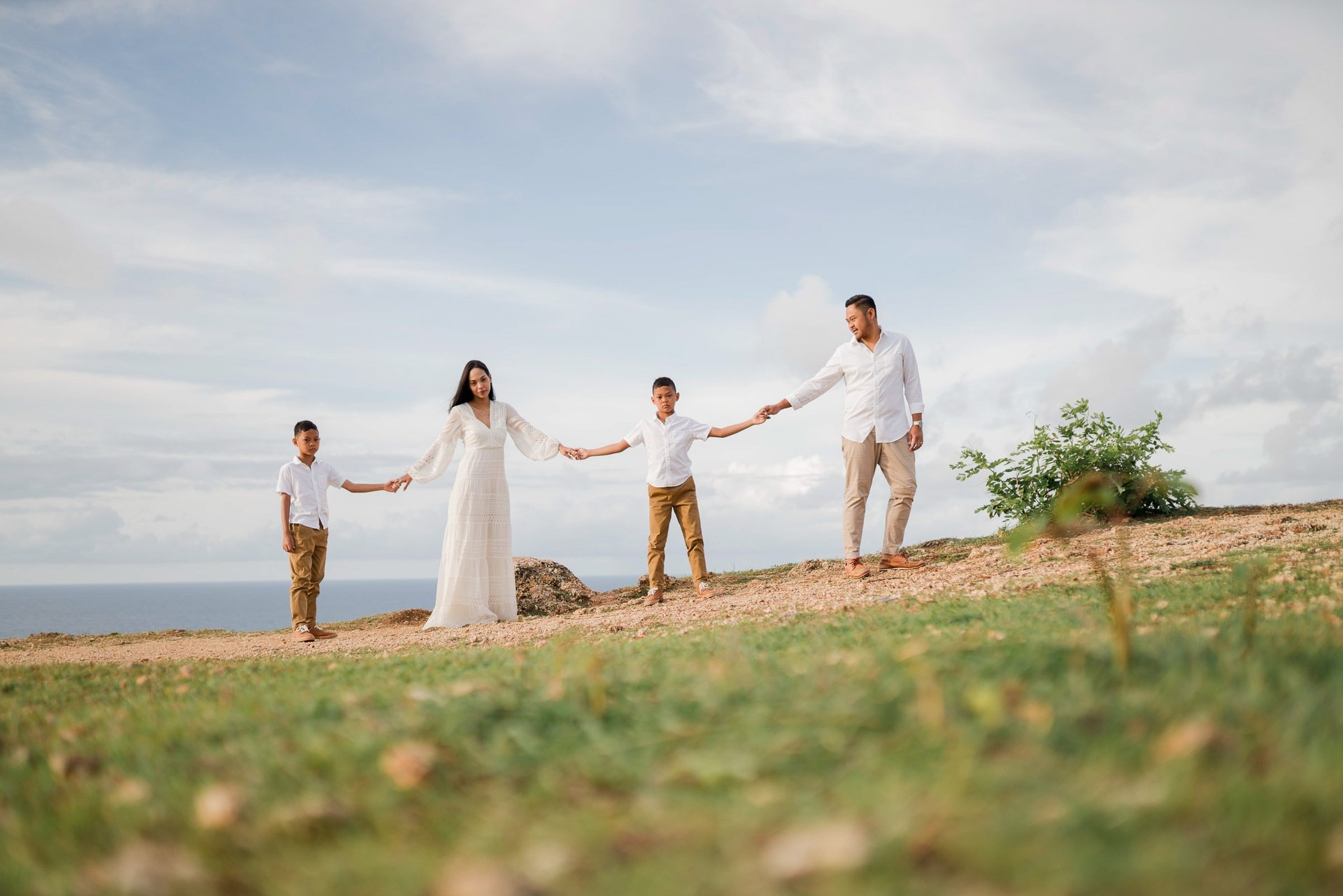 Timeless family photography moment of Ayunda family at Melasti Beach Bali.