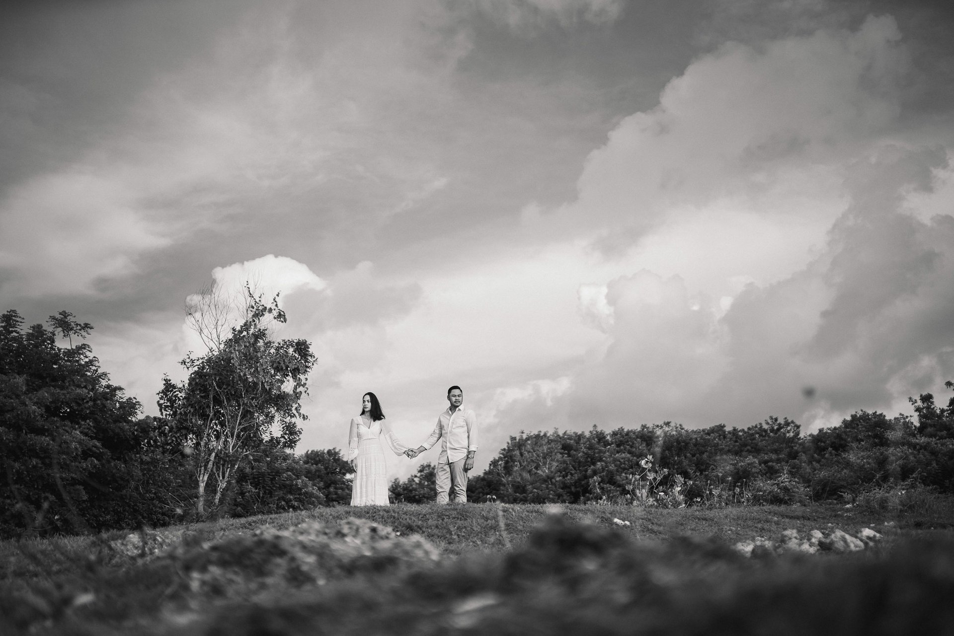 Intimate moment of Ayunda family embracing at Melasti Beach Bali.