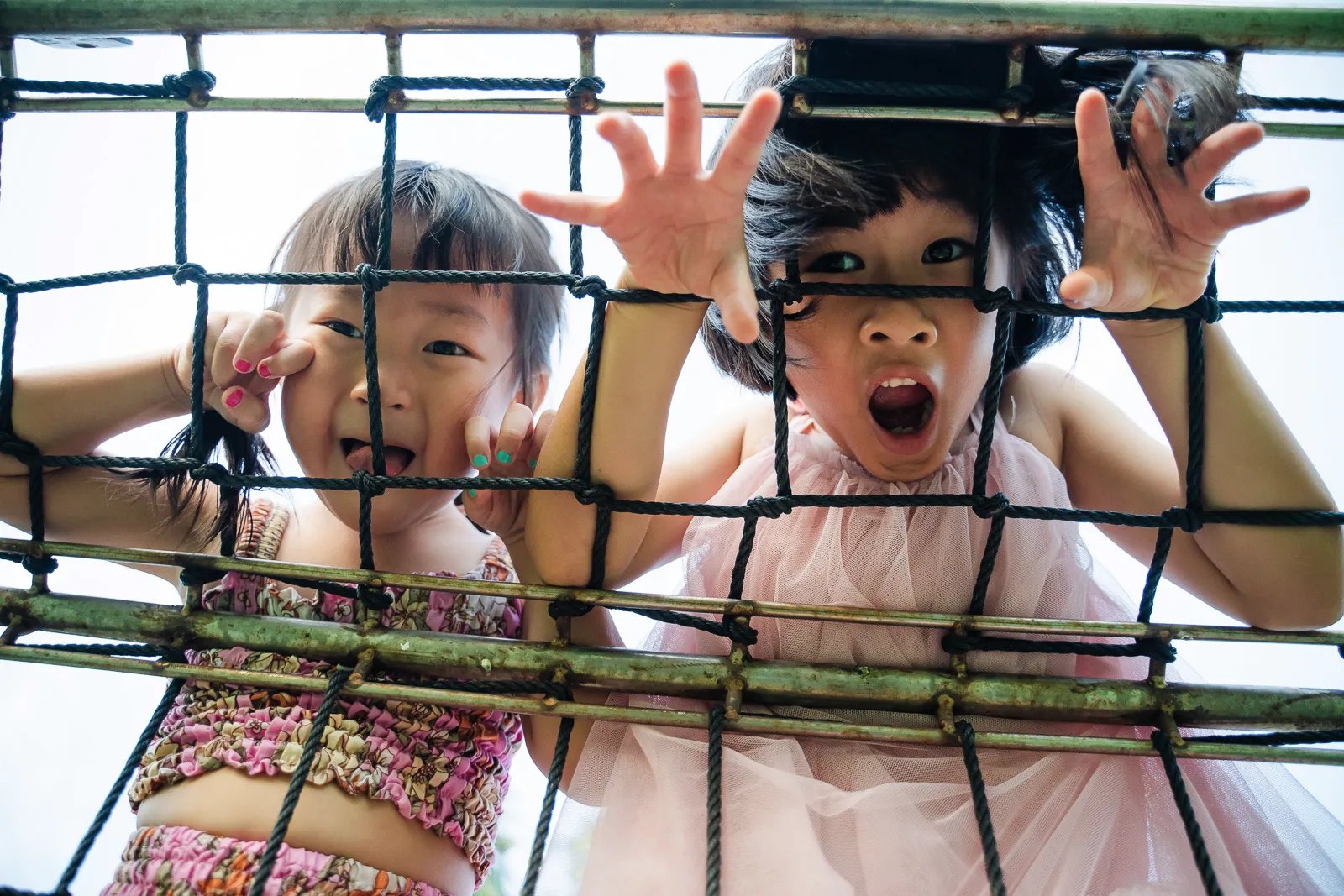 Children playing during family photography session at Legian Bali captured in candid and joyful atmosphere.