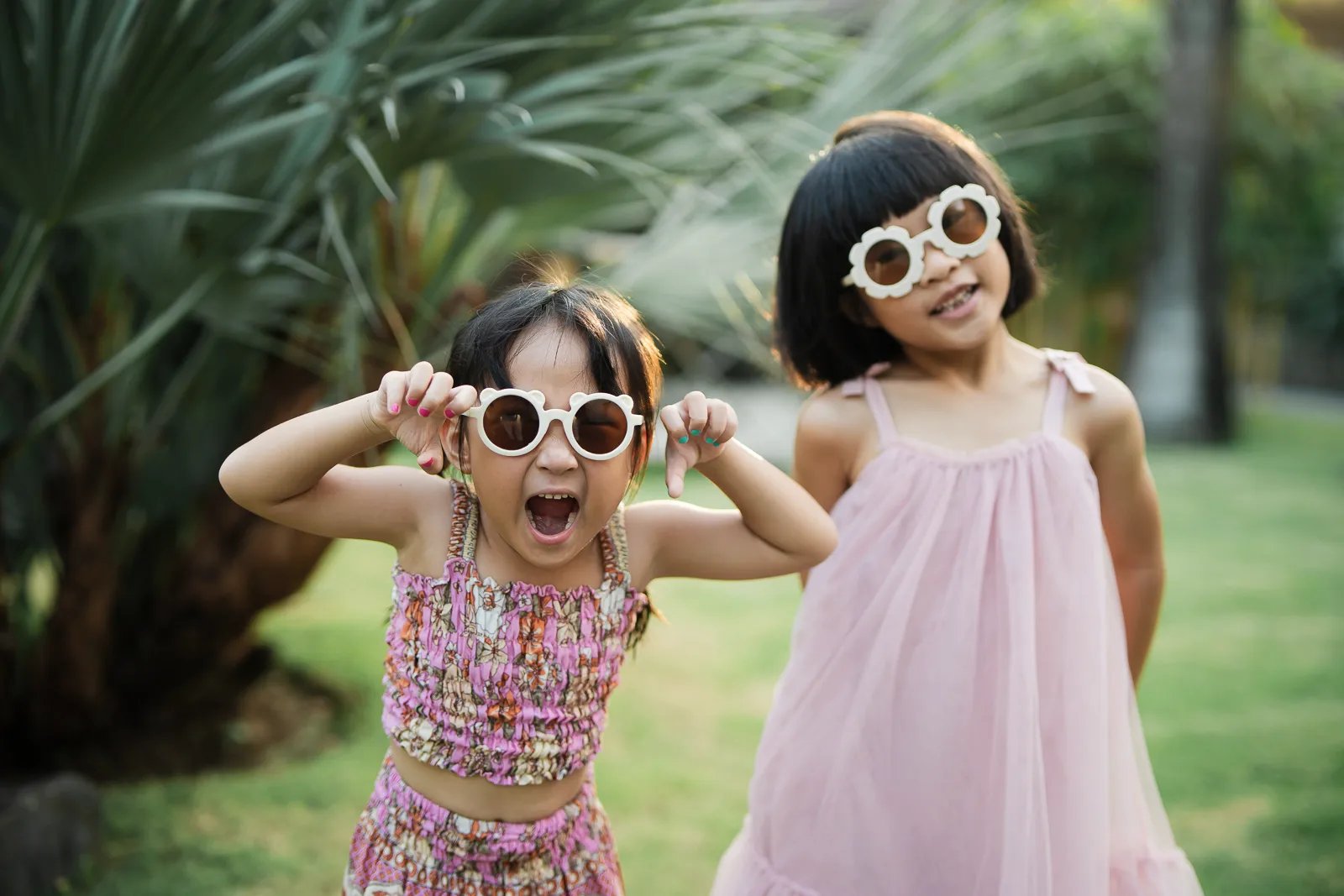 Children playing together at Padma Resort Legian Bali during joyful candid family photography session.