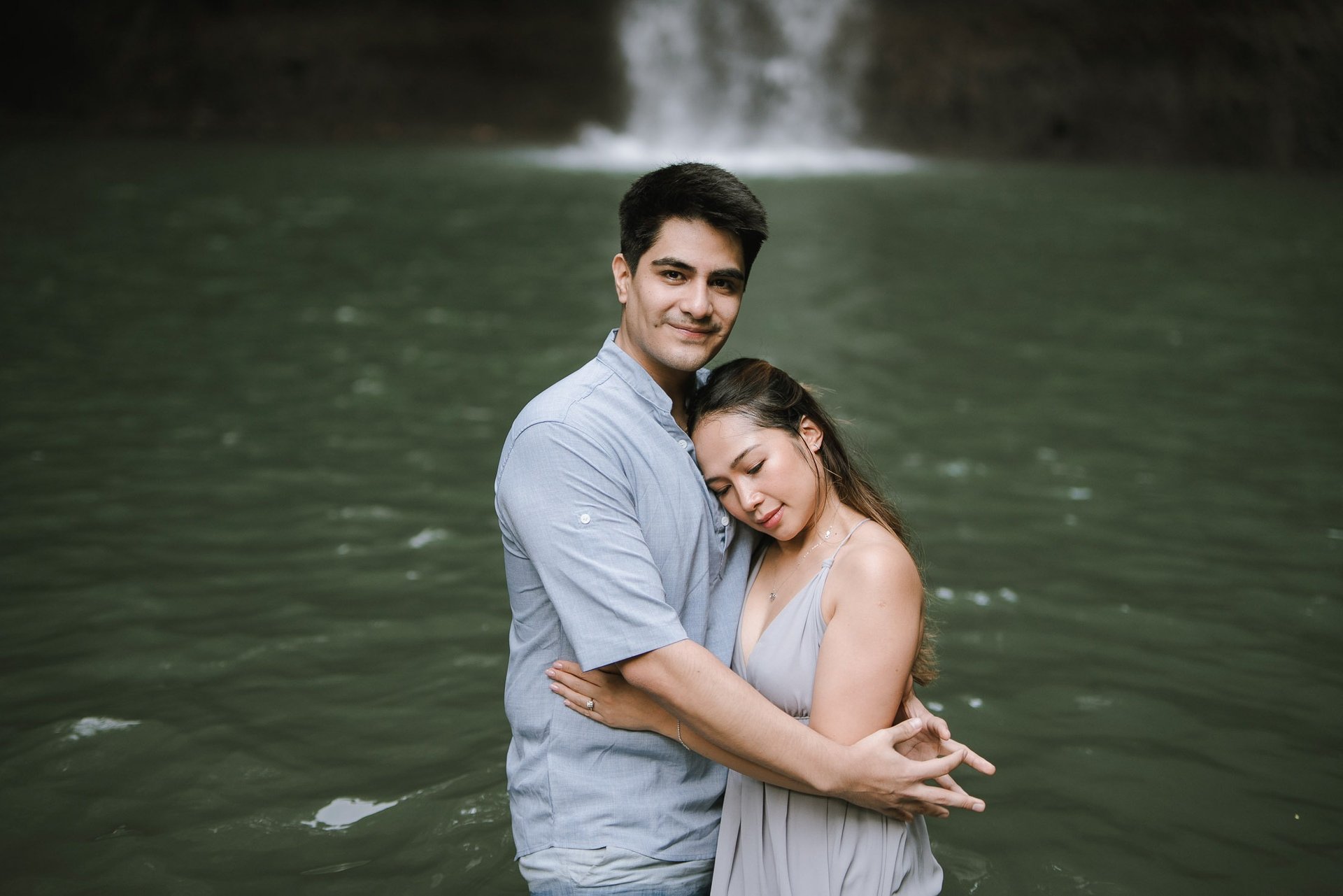 Romantic prewedding embrace at Tibumana Waterfall Bangli Bali