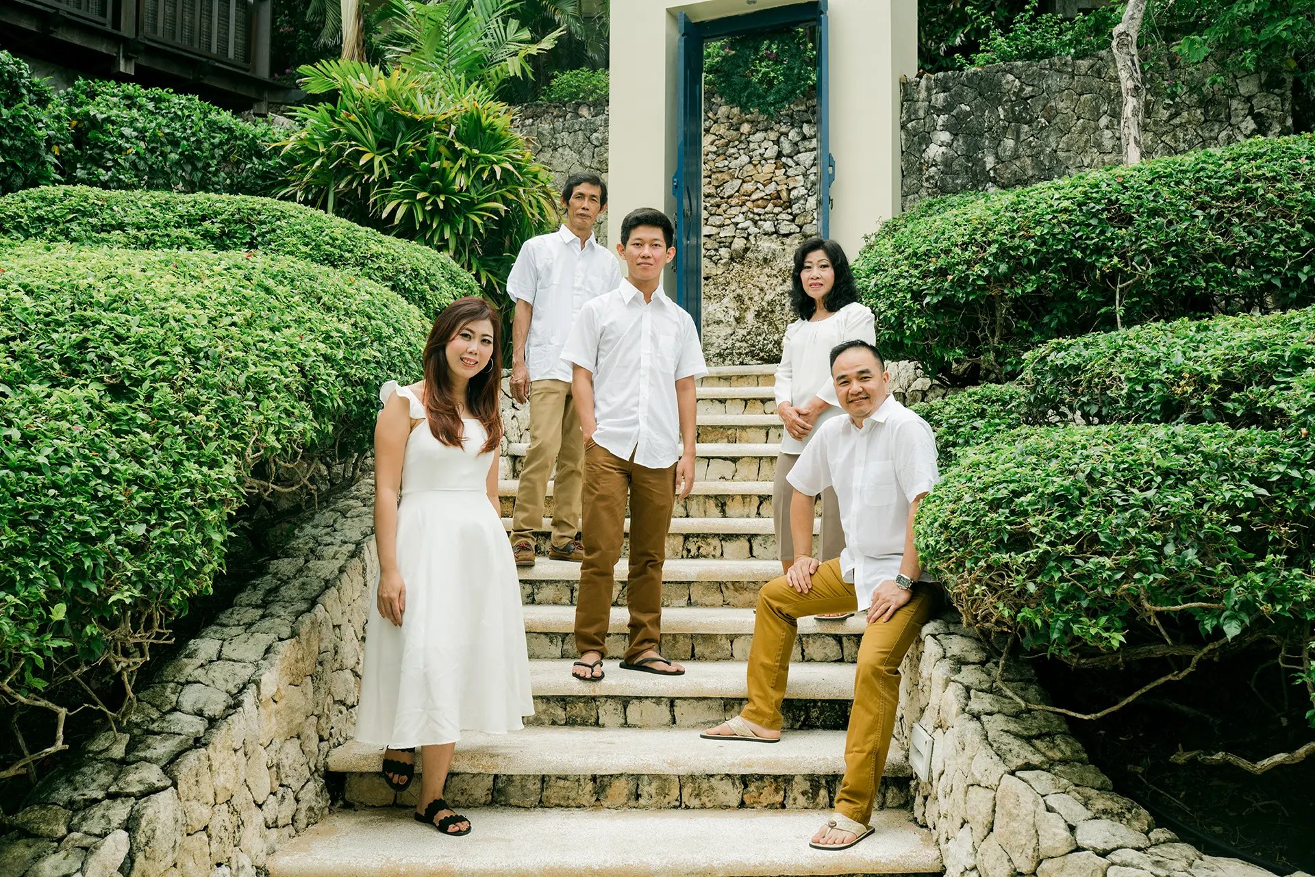 Selly family together on garden stairs at Karma Kandara Uluwatu Bali  