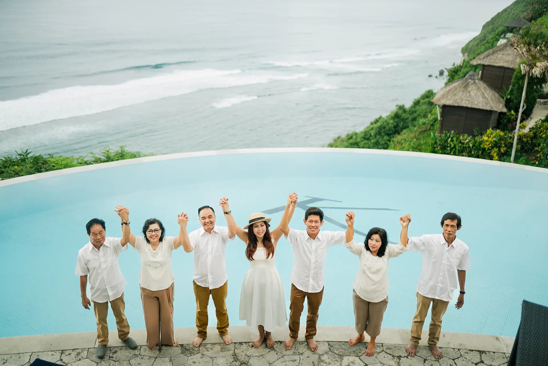 Selly family enjoying the infinity pool view at Karma Kandara Uluwatu Bali  