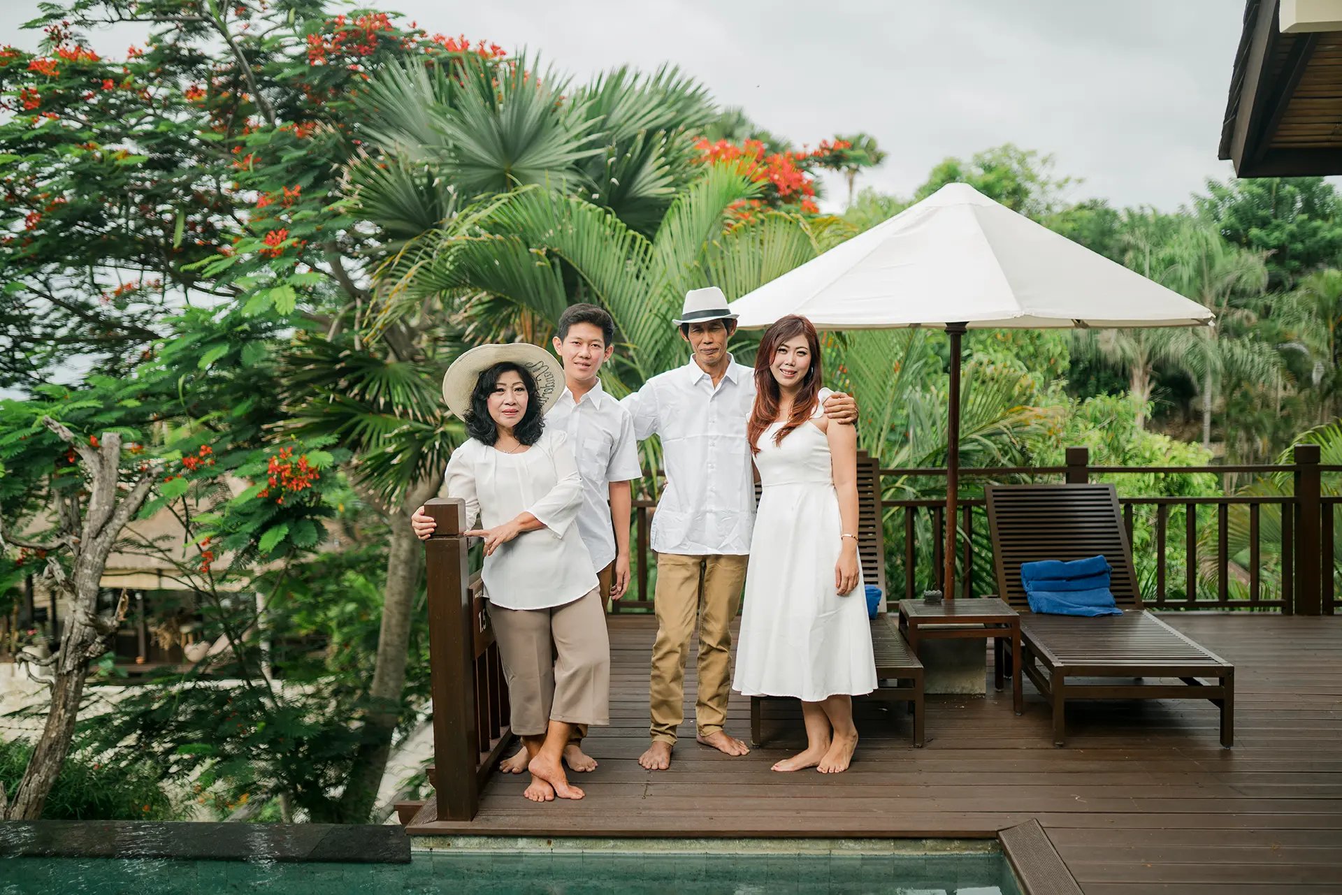 Selly family relaxing in the tropical villa garden at Karma Kandara Bali  