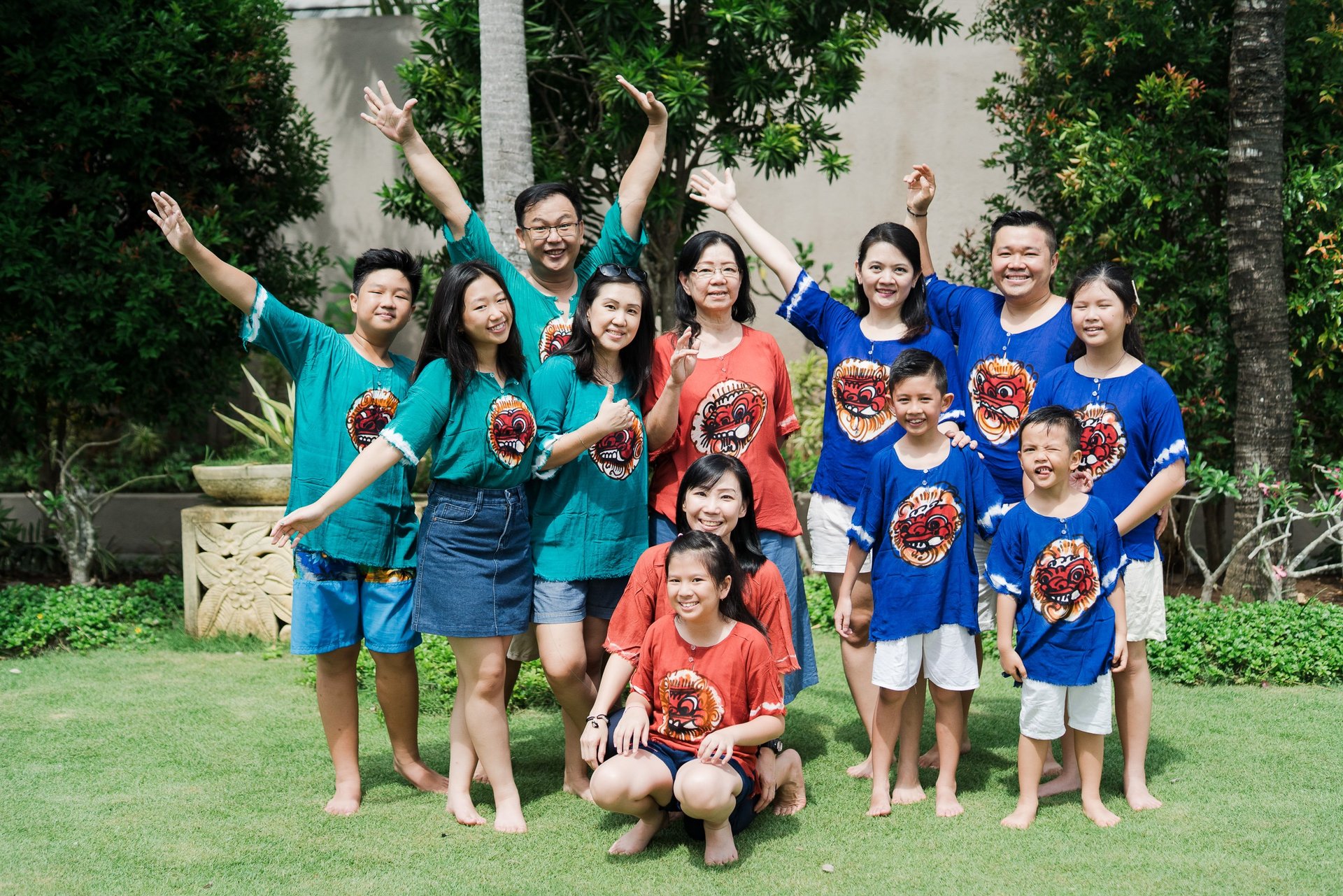 Playful extended family group interaction at Lumbini Villas Jimbaran Bali capturing energetic and candid moments together