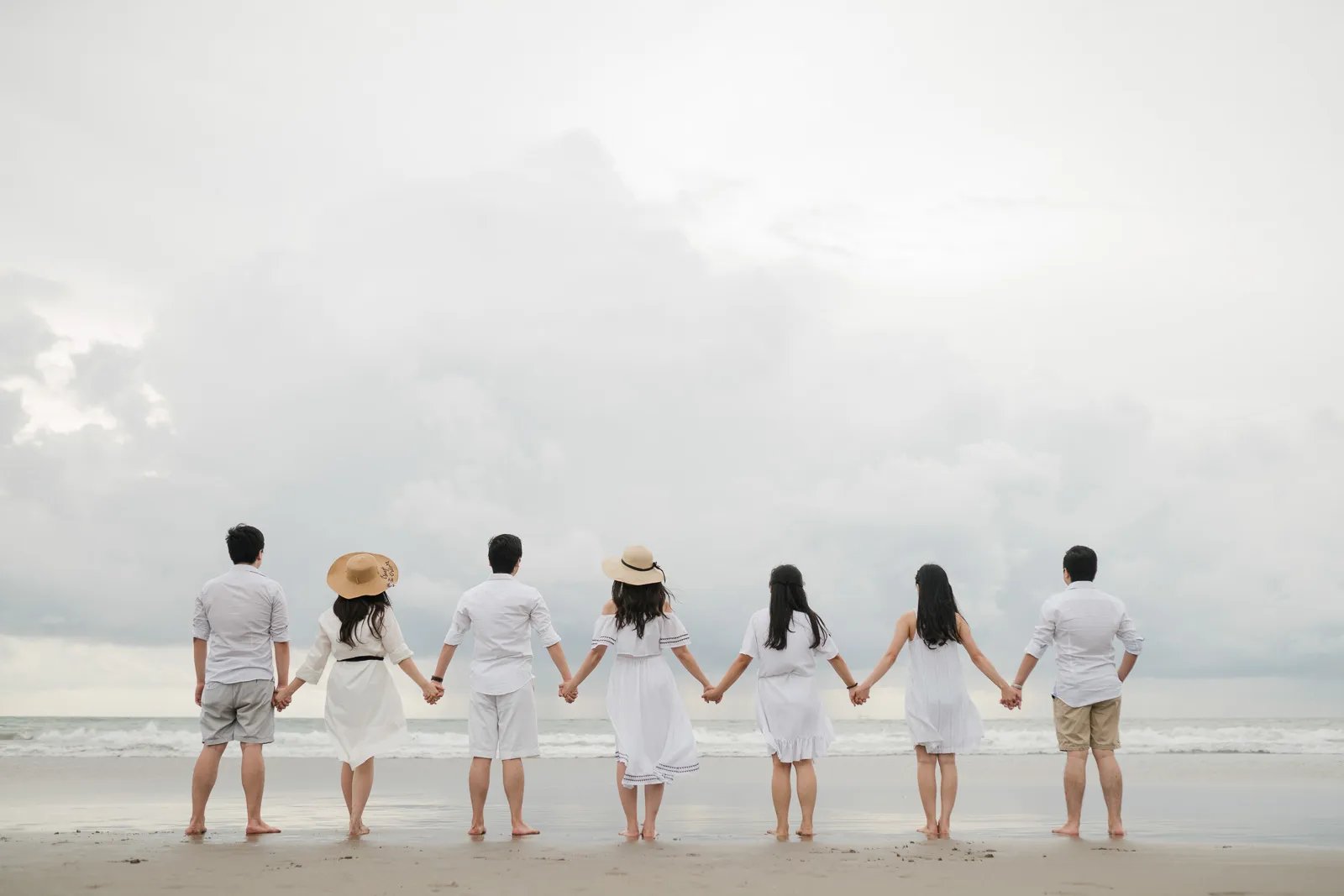 Multigeneration family silhouette at Seminyak Beach Bali captured in calm and timeless family photography atmosphere.
