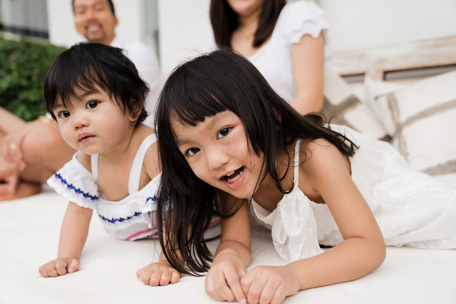 Natural portrait of children relaxing indoors during a family photography session at a private villa in Seminyak Bali.