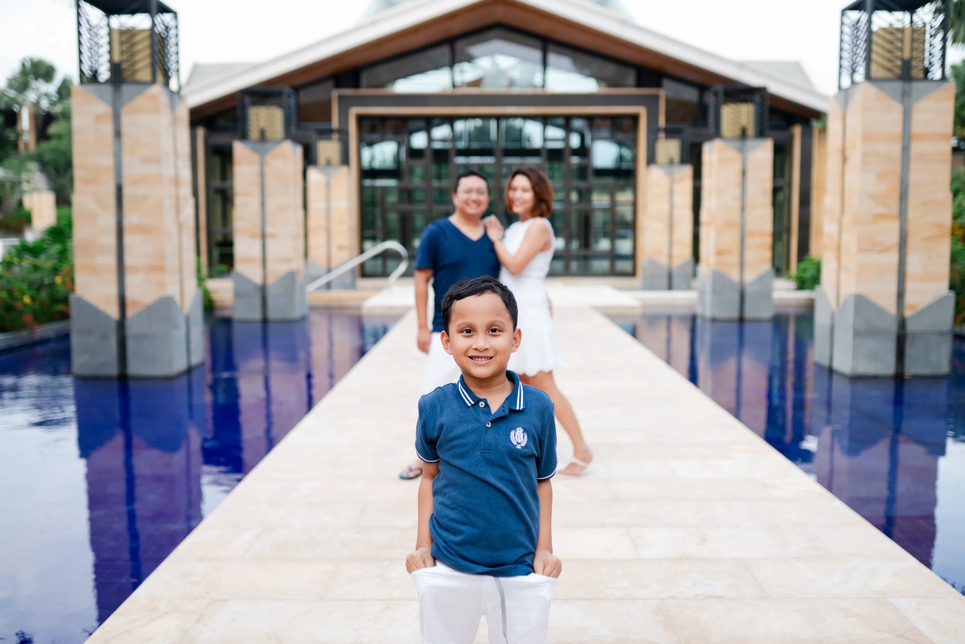 Family portrait on resort walkway at The Mulia Nusa Dua Bali