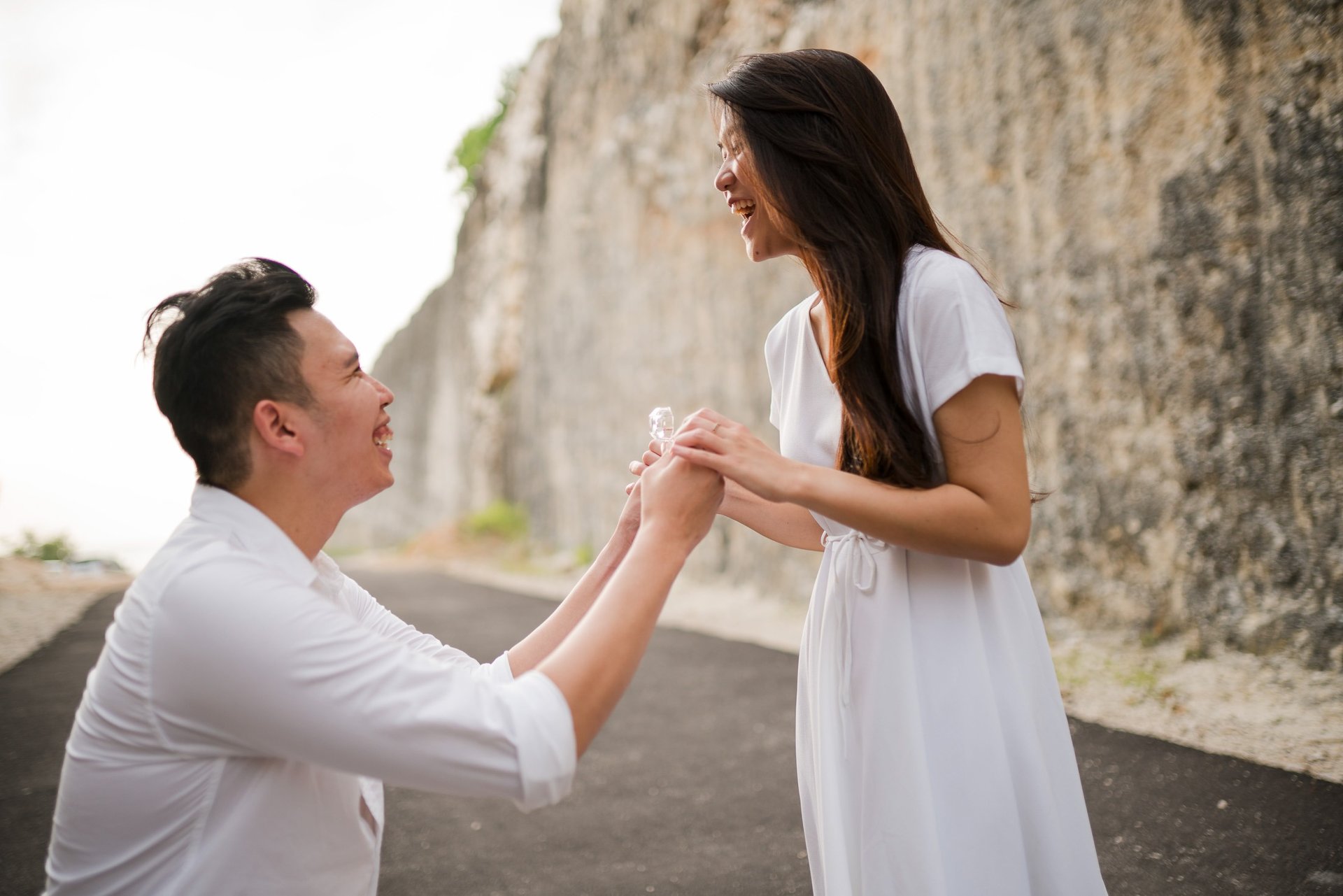Surprise proposal moment with couple at Melasti Beach Bali