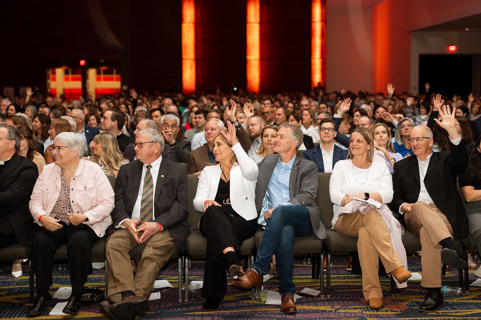 Iowa Catholic Radio Event a group of people sitting in chairs at a conference