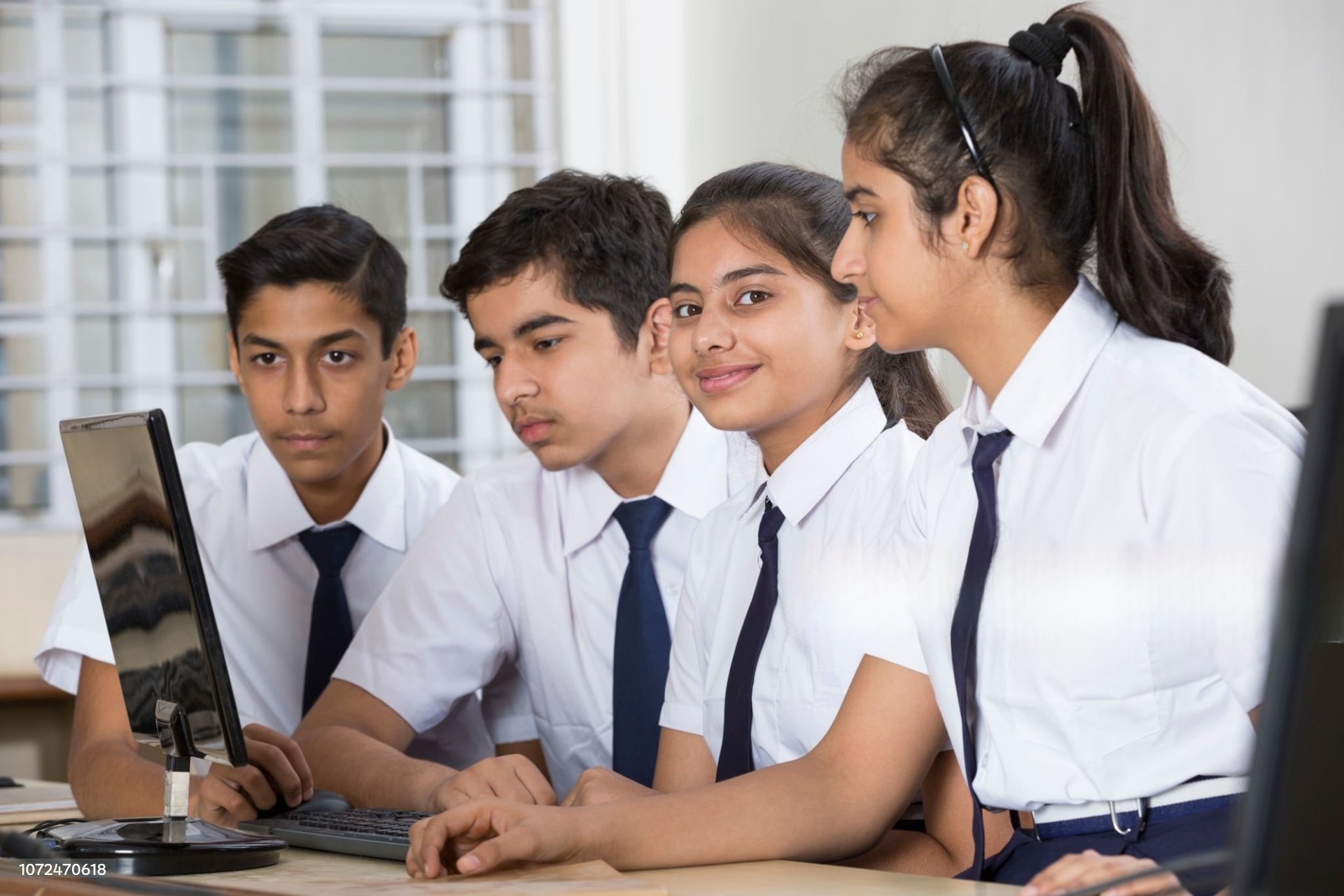 Computer Training, students learning in a digital classroom at Smart Village Computer.