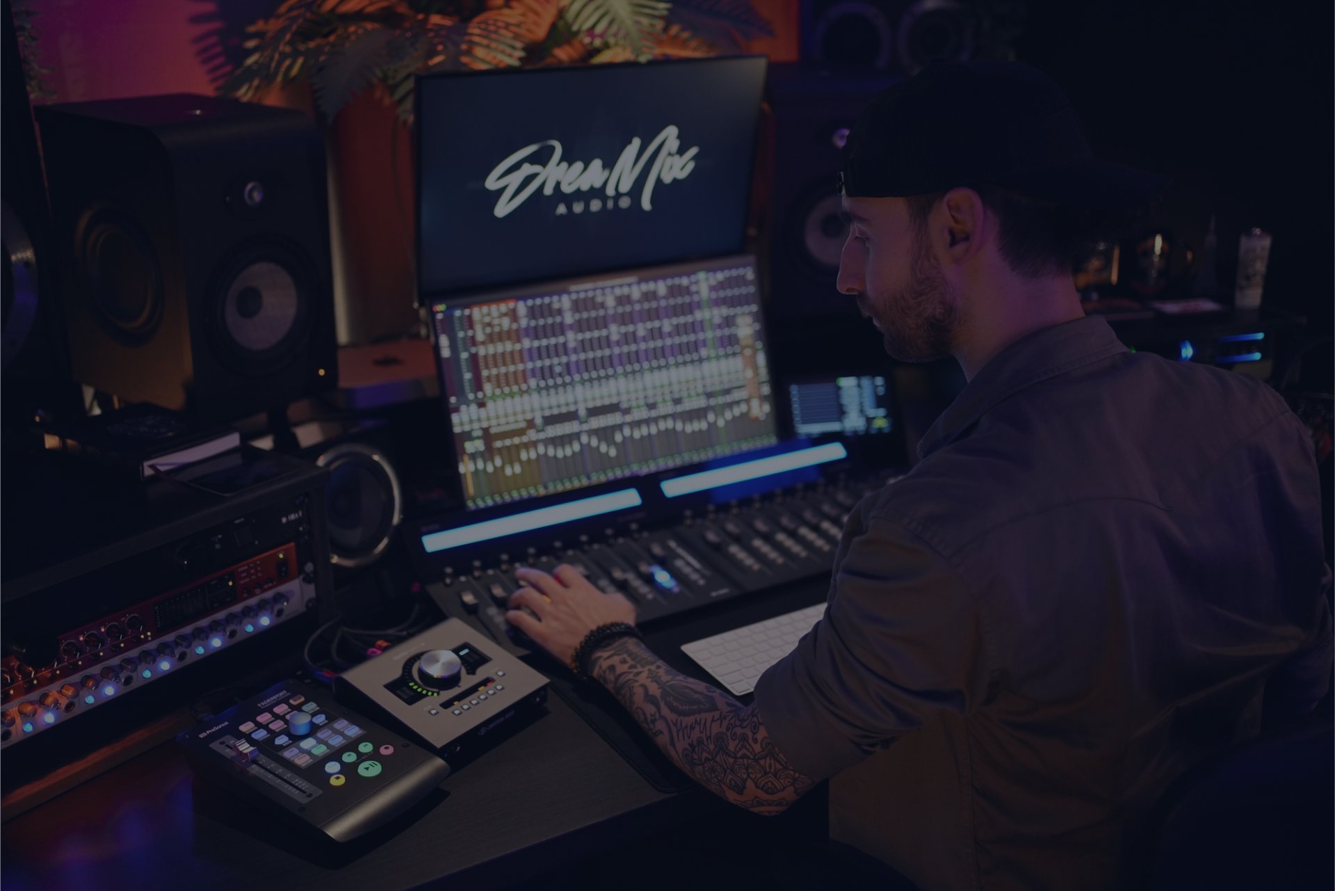 Mixing engineer Andrea “Drea” Succi working on a mix in the studio at DreaMix Audio.