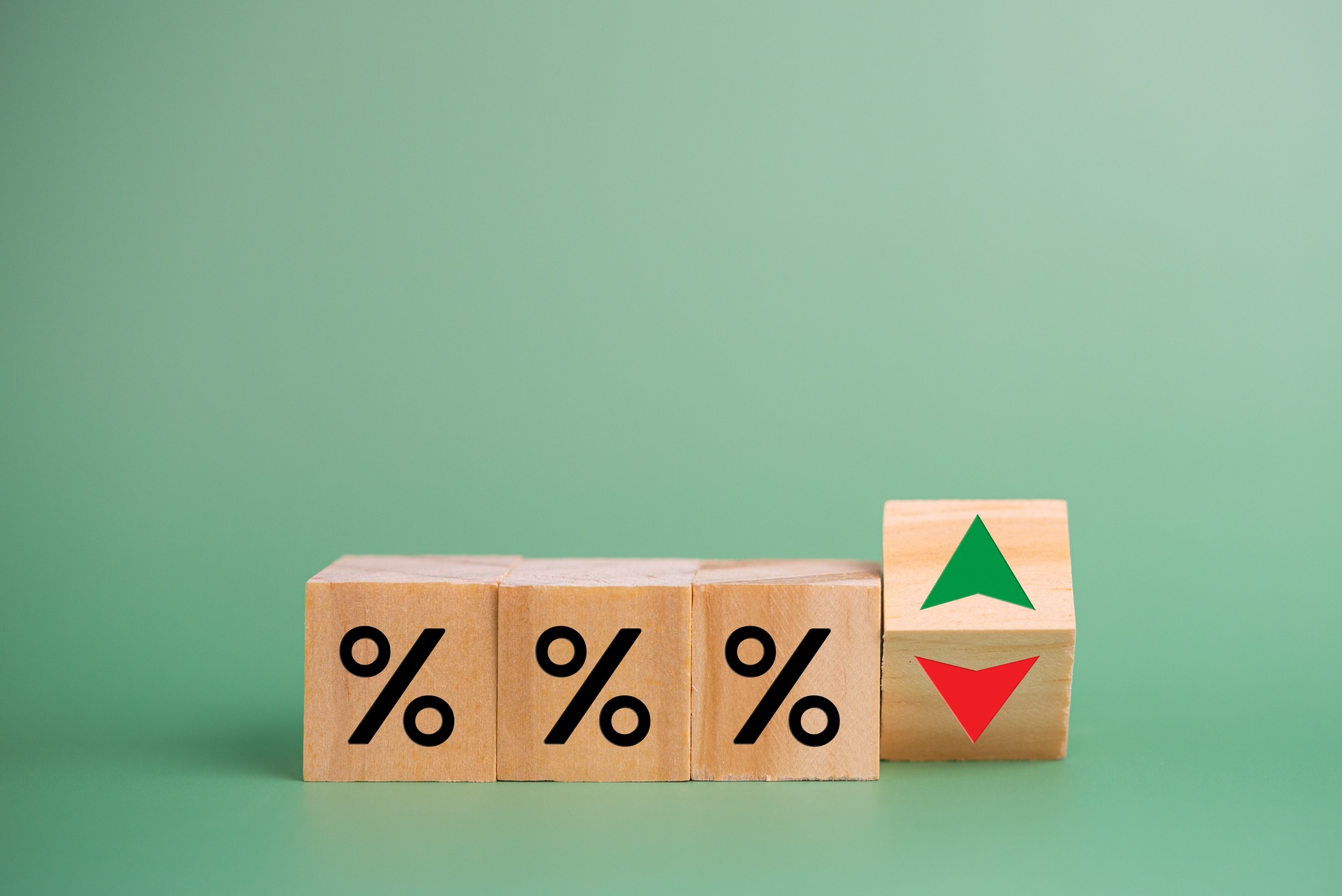interest rate symbols with a red arrow going down for rate cuts