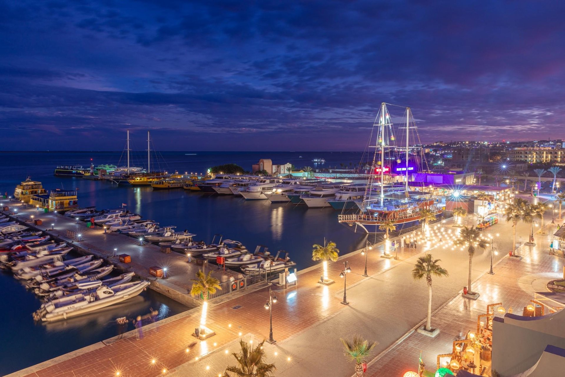 Marina living with yachts vs beachfront apartments with sea view and sandy beach lifestyle.