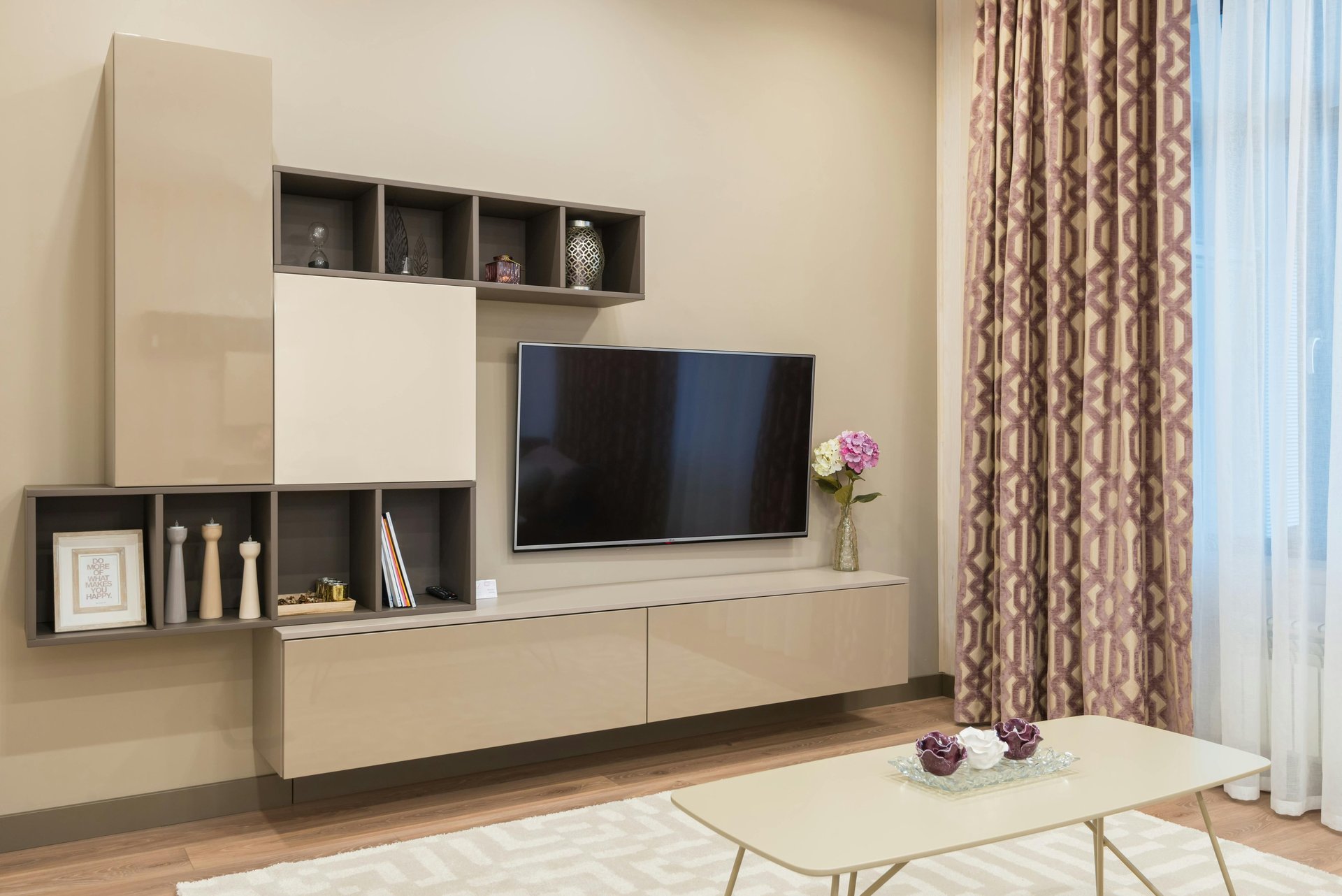 a living room with a television and a couch