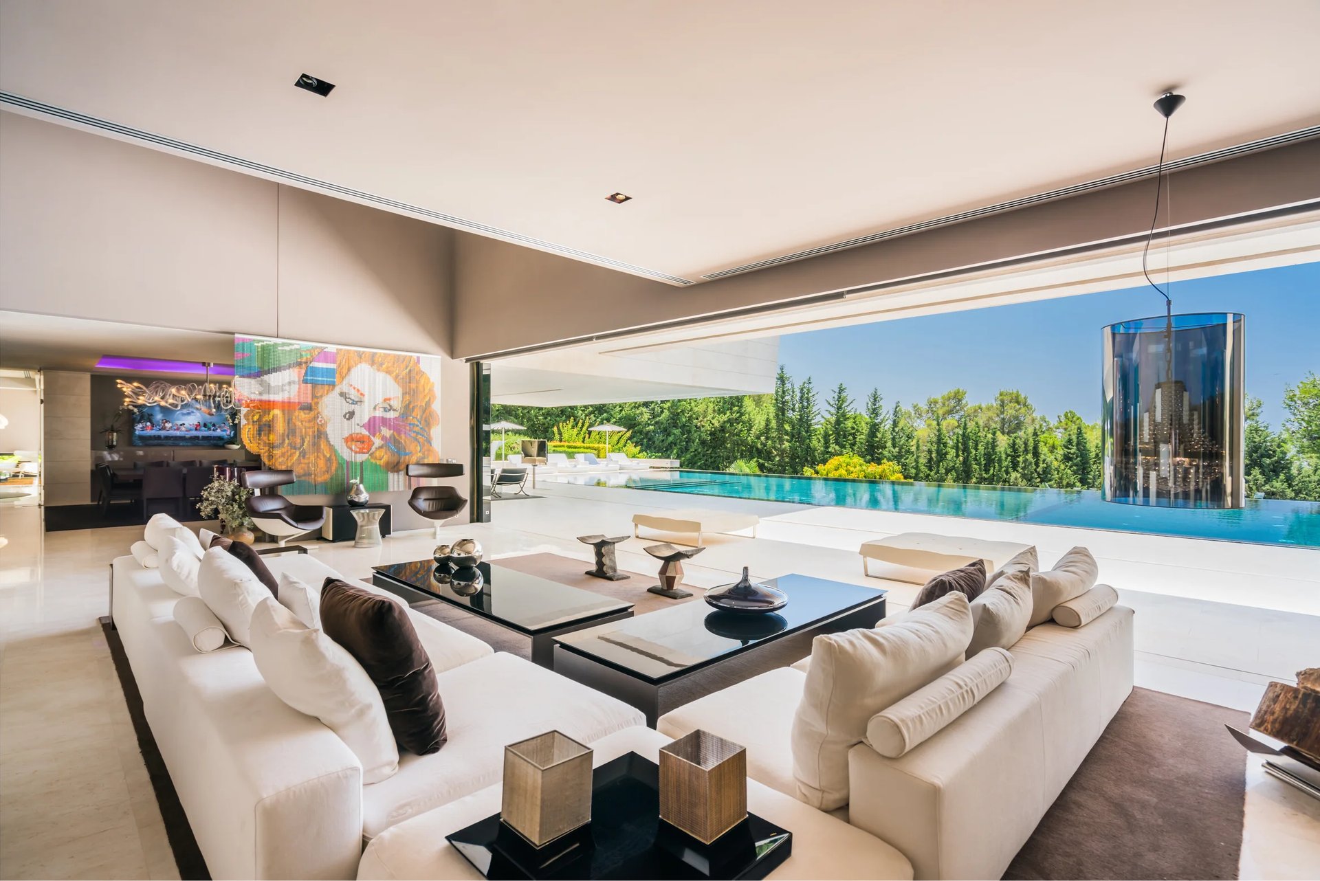 Contemporary lounge with panoramic pool terrace