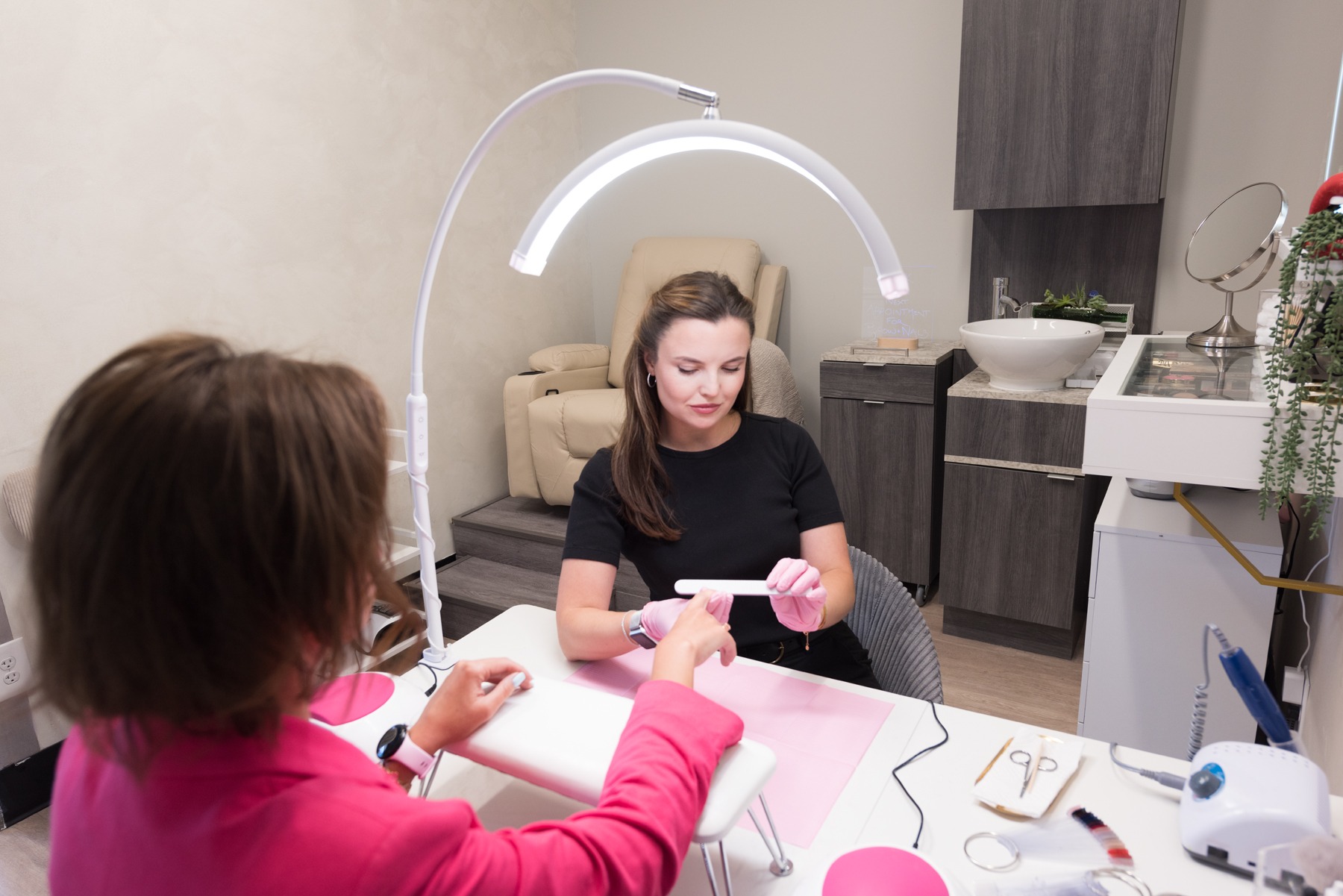 Anastasia wit ha client in her nail studio in Sausalito