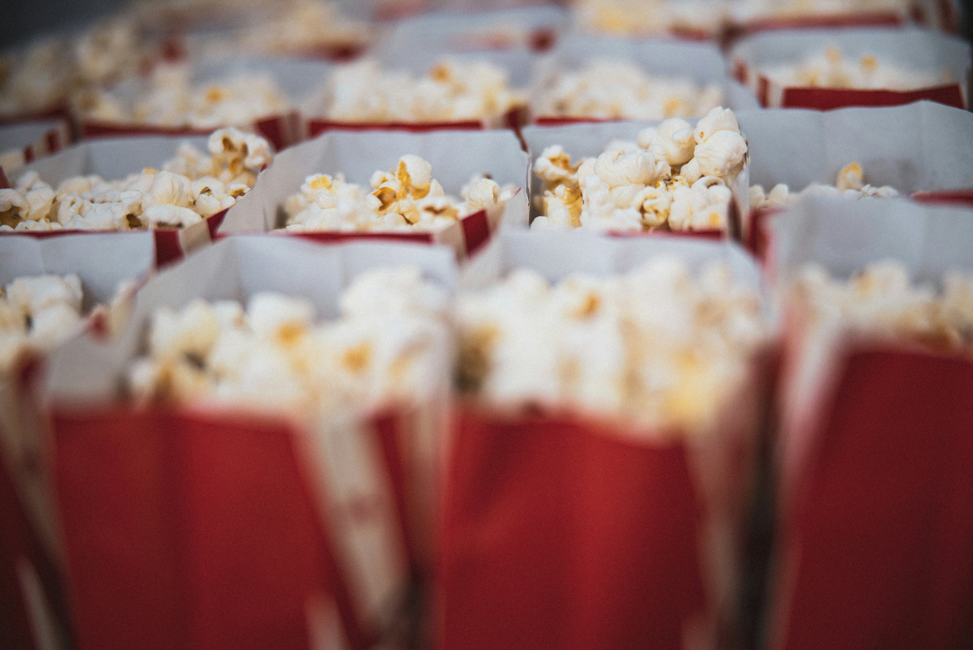 Rows of movie popcorn in red bags 