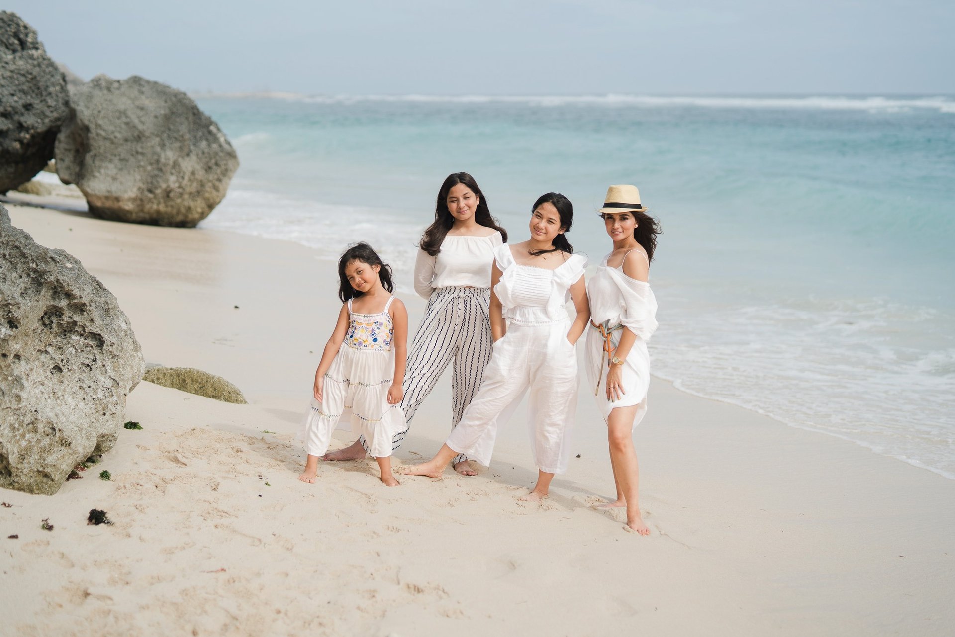 Family in a wide coastal view at Karma Kandara Bali beach