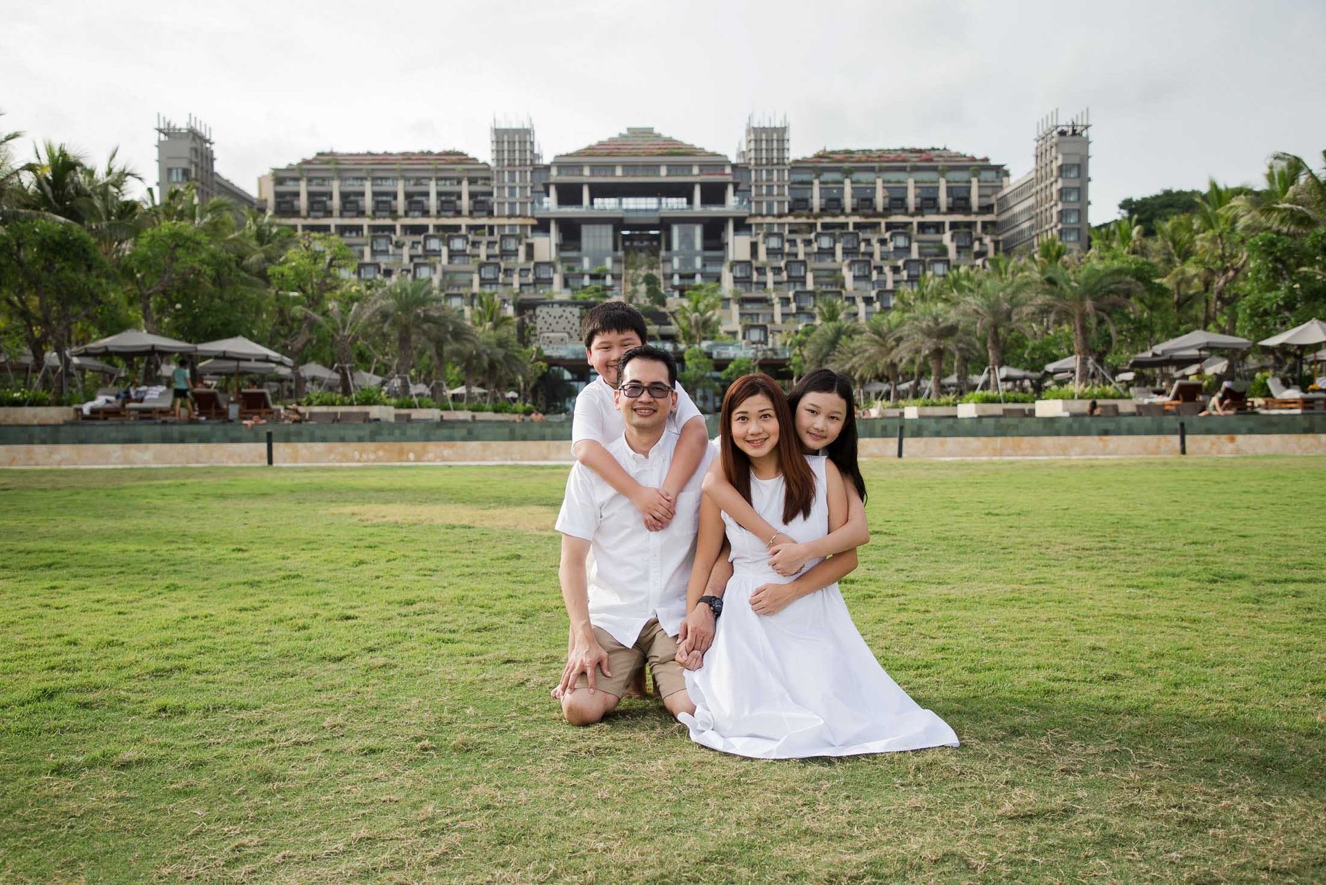 Elegant family portrait during a luxury family photography session at Kempinski Bali resort