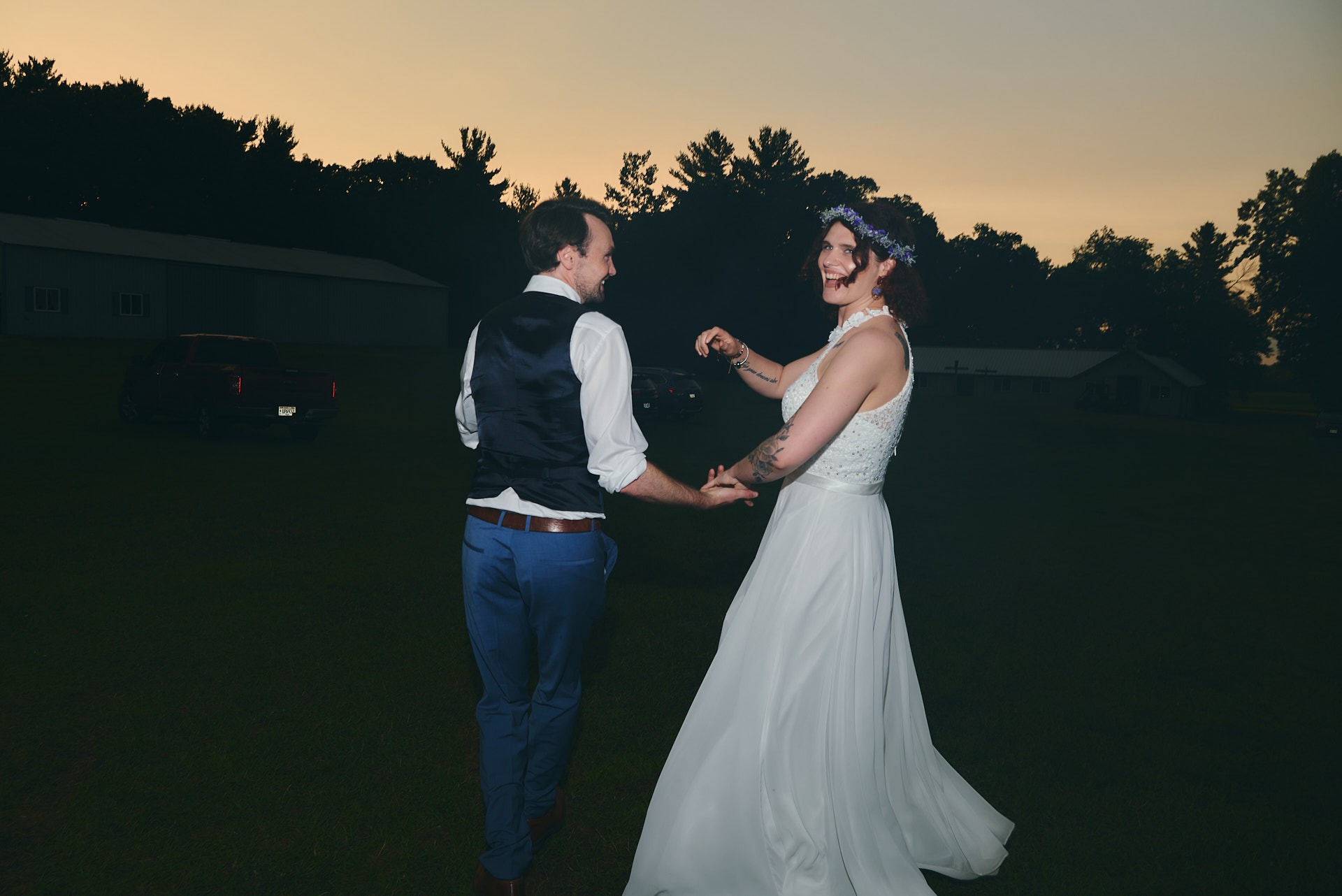 a bride and groom dancing at their wedding outdoor