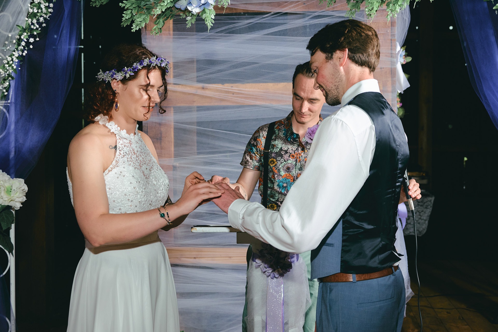 a man and woman getting married and exchanging rings in a wedding ceremony