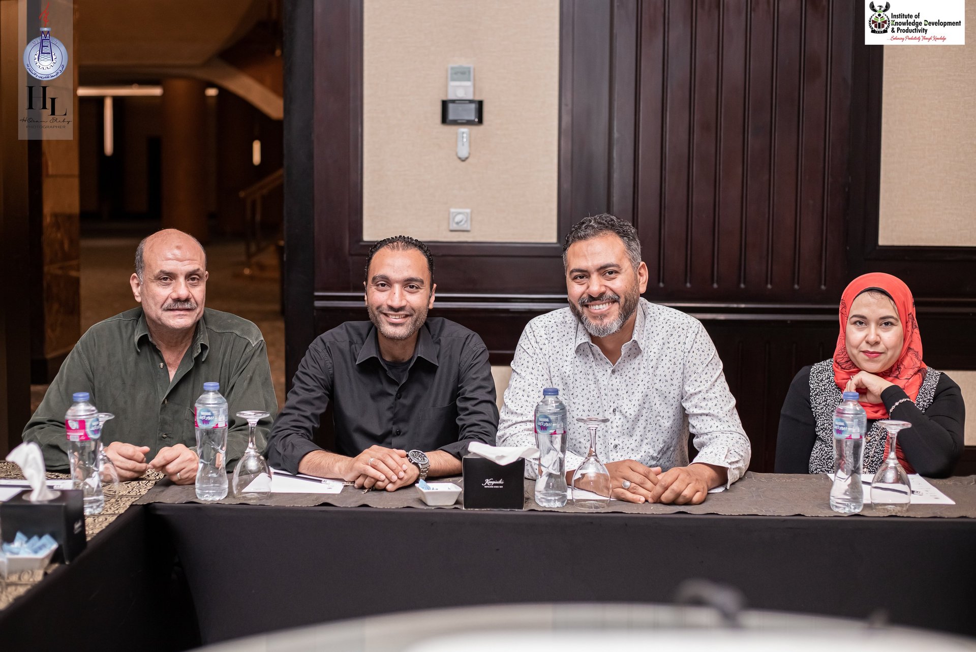 a group of people sitting at a table