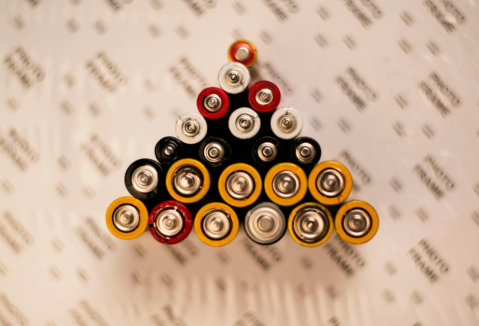Batteries of various sizes in a triangle formation