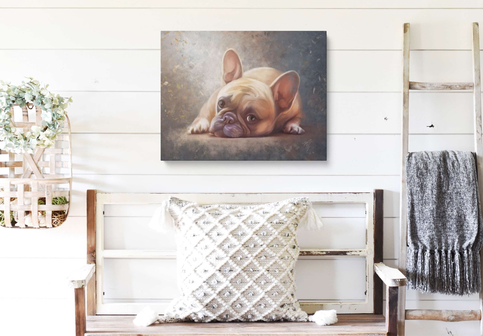 a portrait of a french bulldog hanging in a room